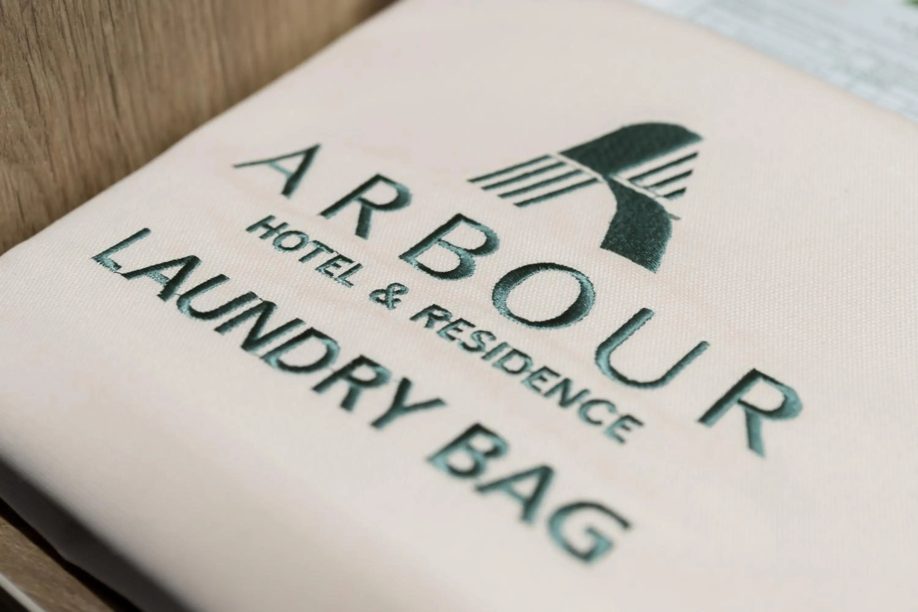 Property logo or sign in Arbour Hotel and Residence