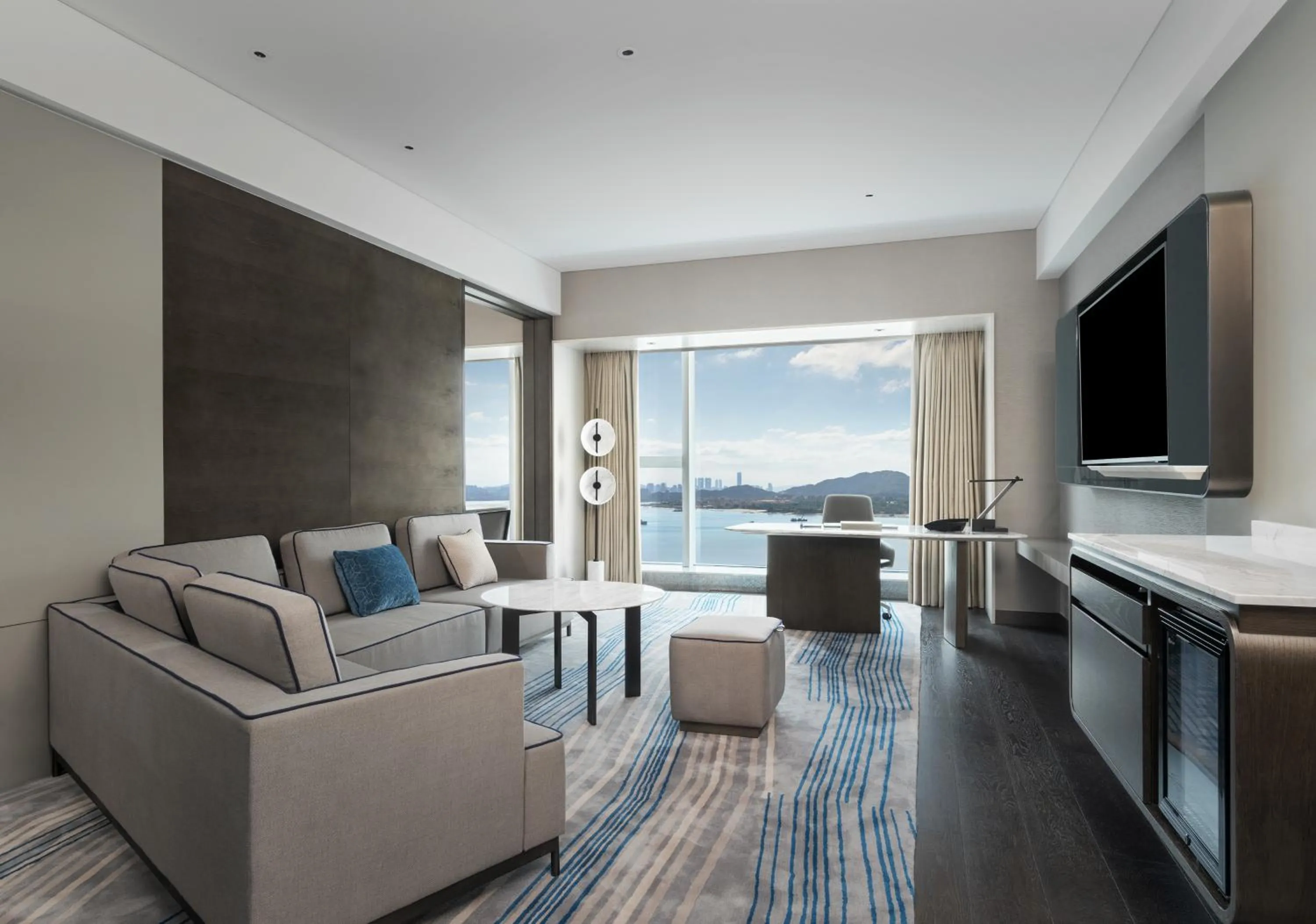 Living room in Crowne Plaza Xiamen Jimei Seaview by IHG-Free Mini Bar