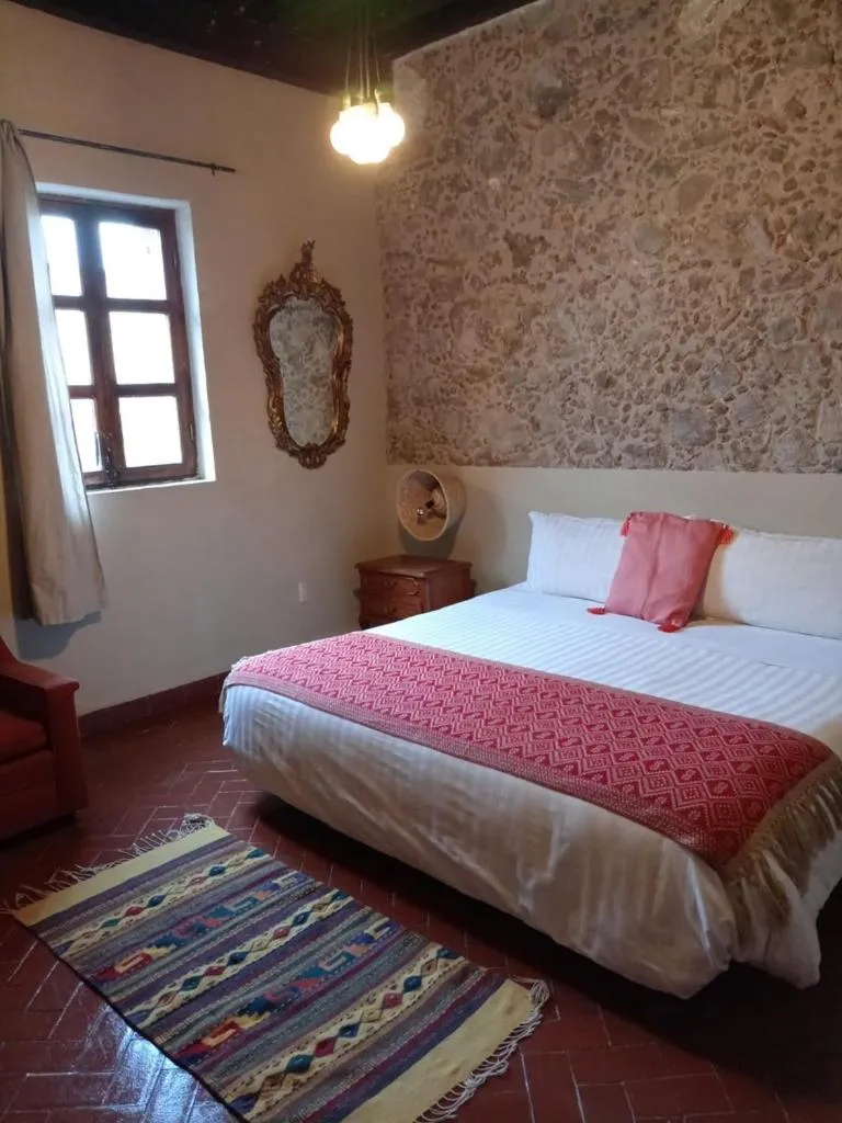 Bed in Posada Colibri - Hotel & Spa
