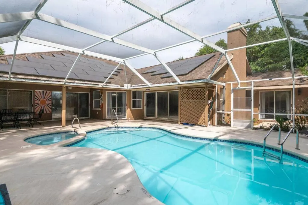 Swimming pool in Tropical Escape with Relaxing Heated Pool & Palm Breezes