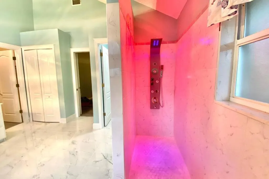 Shower in Tropical Escape with Relaxing Heated Pool & Palm Breezes