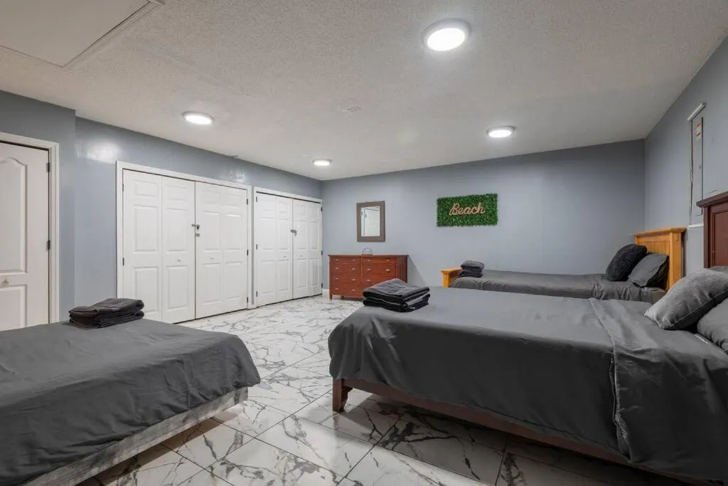 Bed in Tropical Escape with Relaxing Heated Pool & Palm Breezes