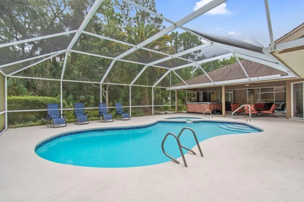 Swimming pool in Tropical Escape with Relaxing Heated Pool & Palm Breezes