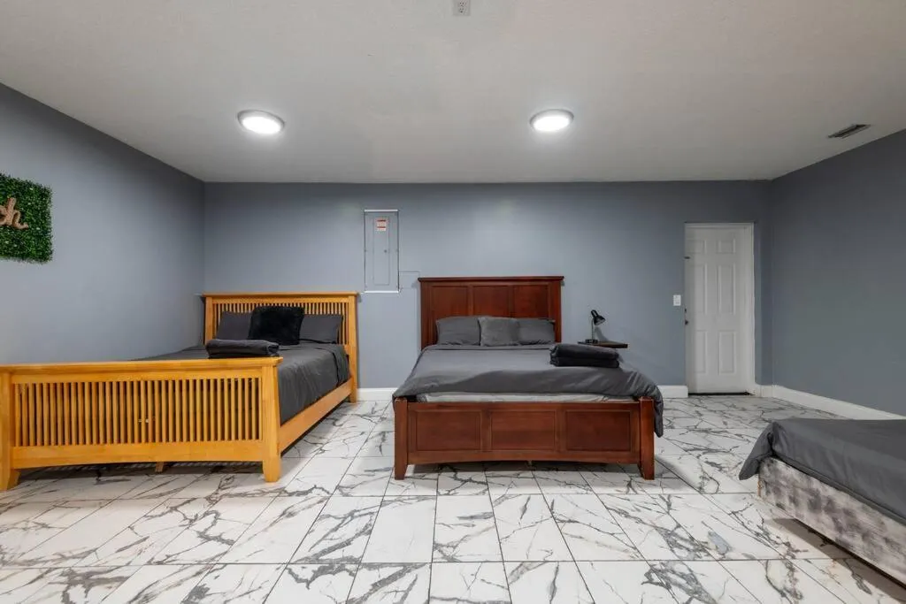 Bed in Tropical Escape with Relaxing Heated Pool & Palm Breezes