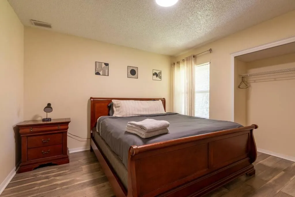 Bed in Tropical Escape with Relaxing Heated Pool & Palm Breezes