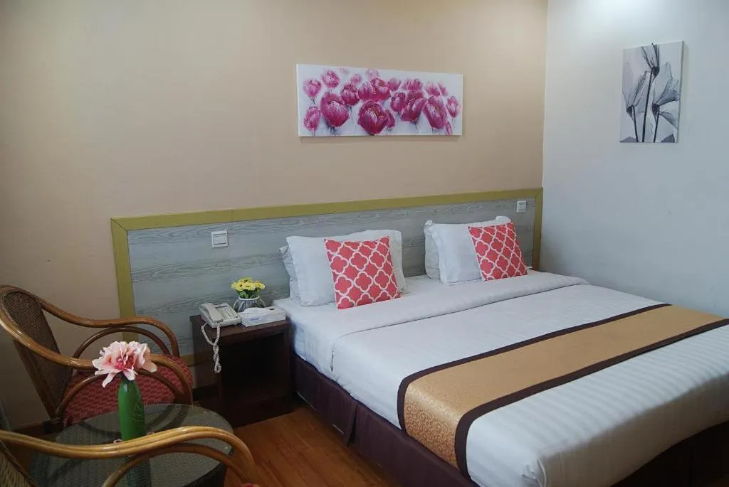 Bed in TD Plaza Hotel