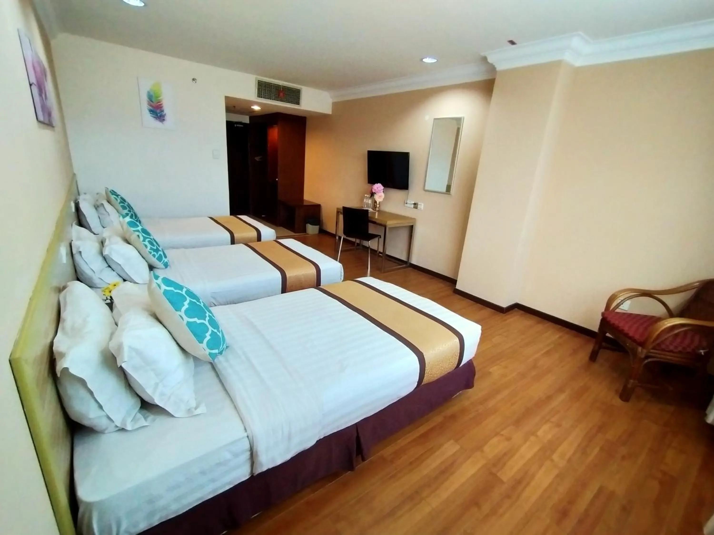 Bed in TD Plaza Hotel