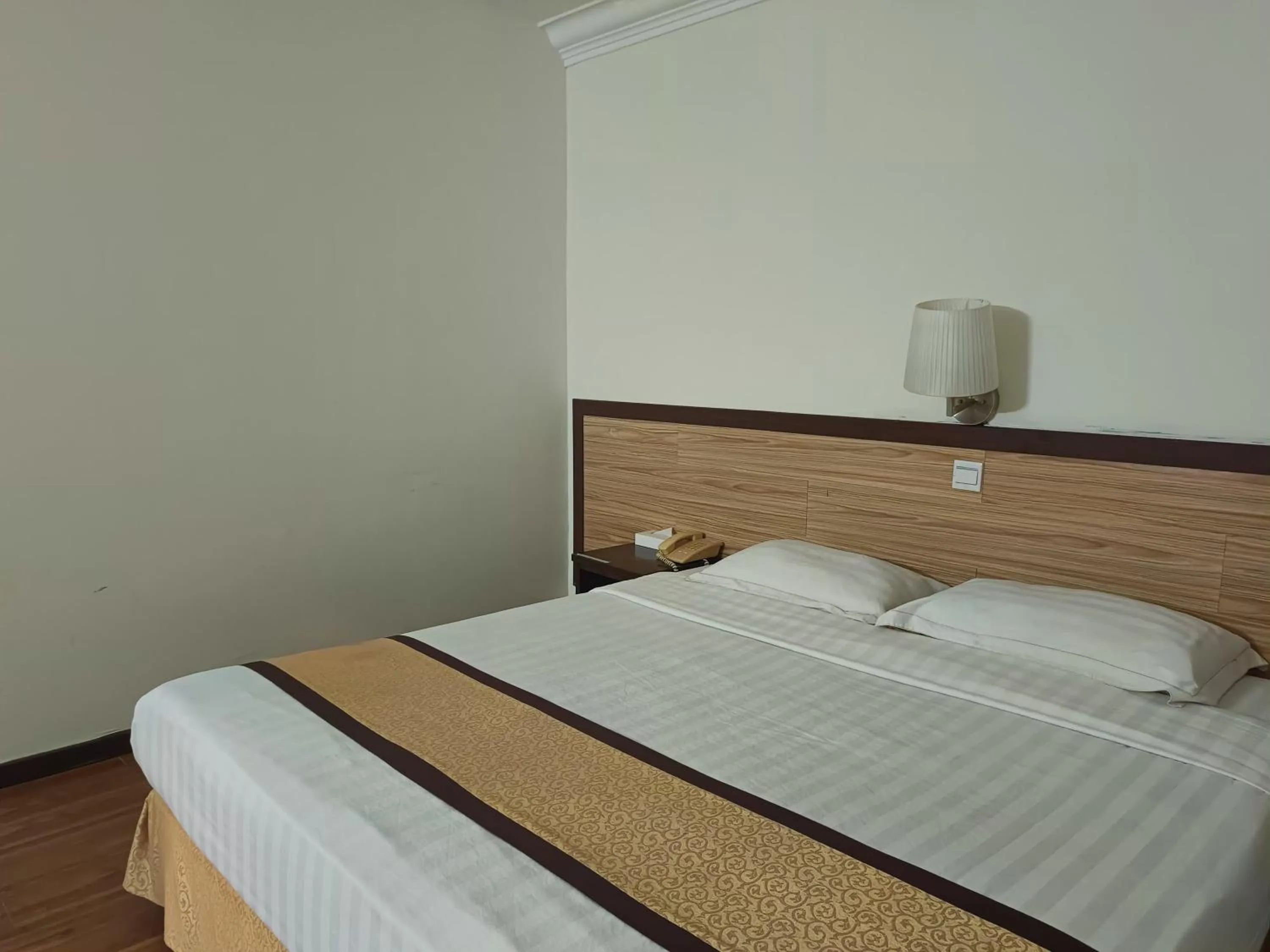 Bed in TD Plaza Hotel