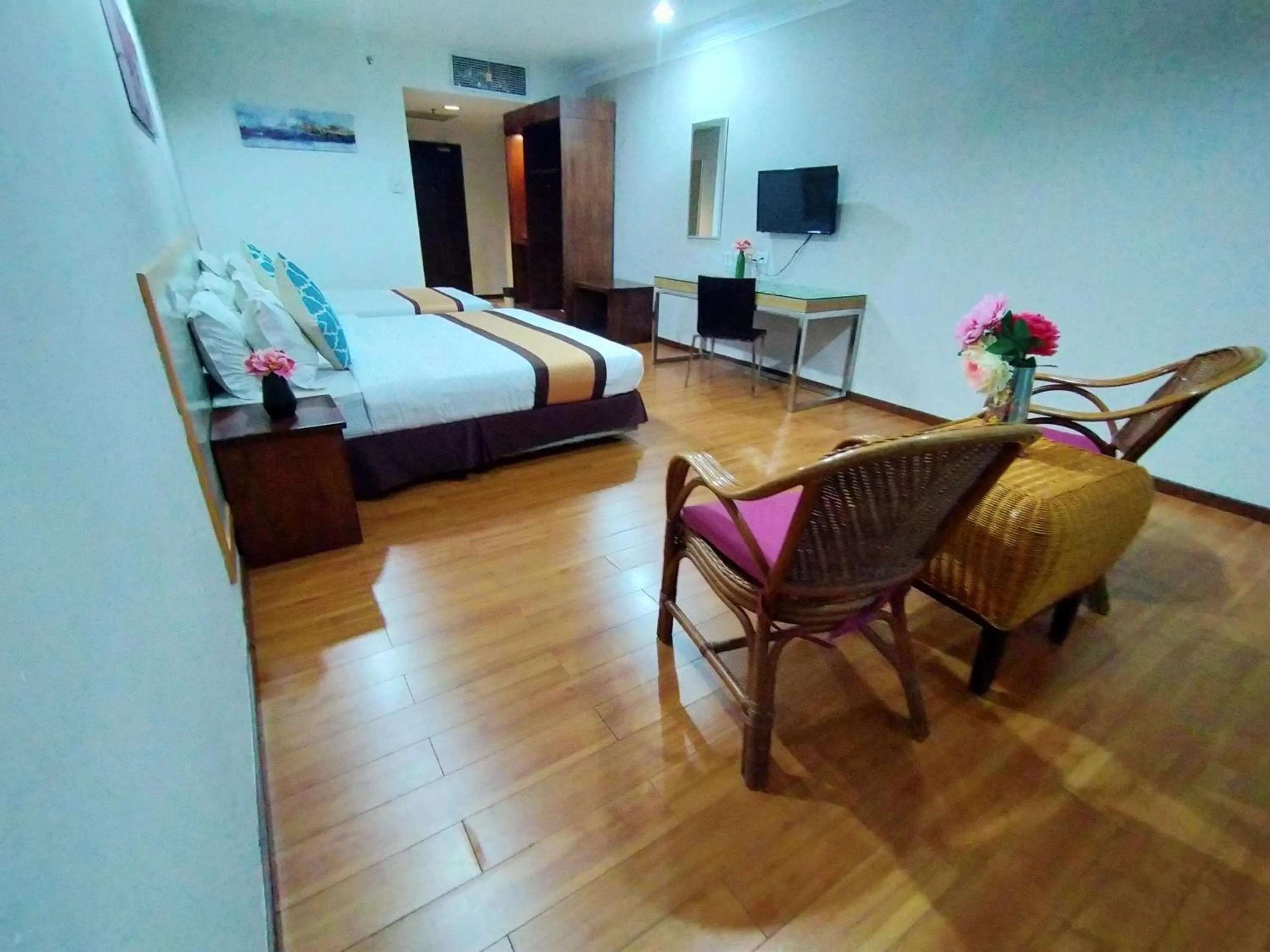 Bed in TD Plaza Hotel