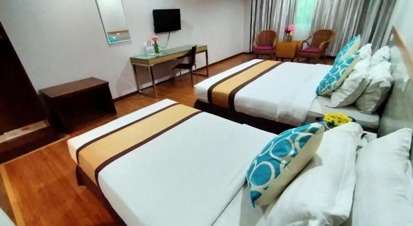 Bed in TD Plaza Hotel