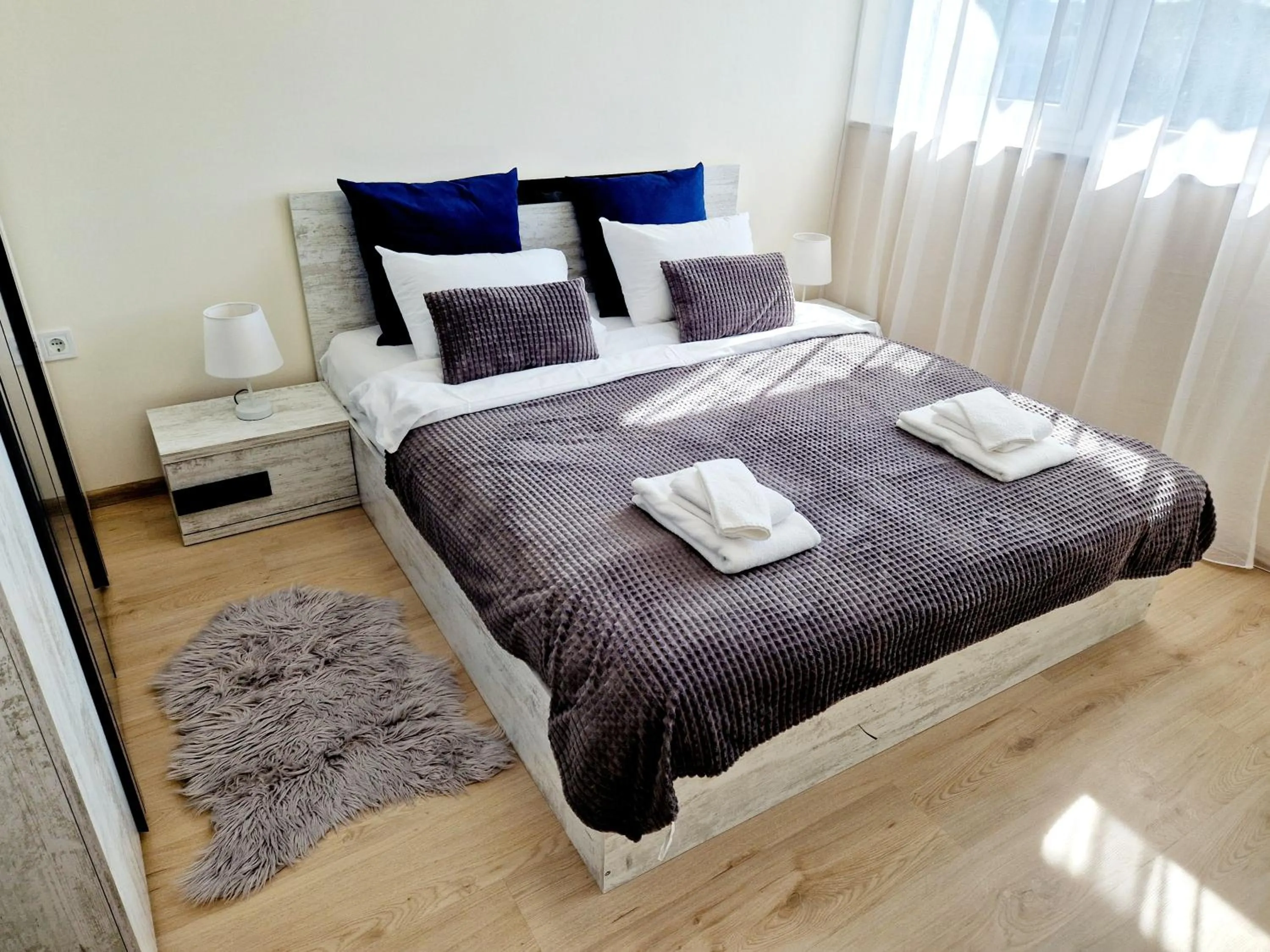 Bed in PAPAYA APARTMENTS