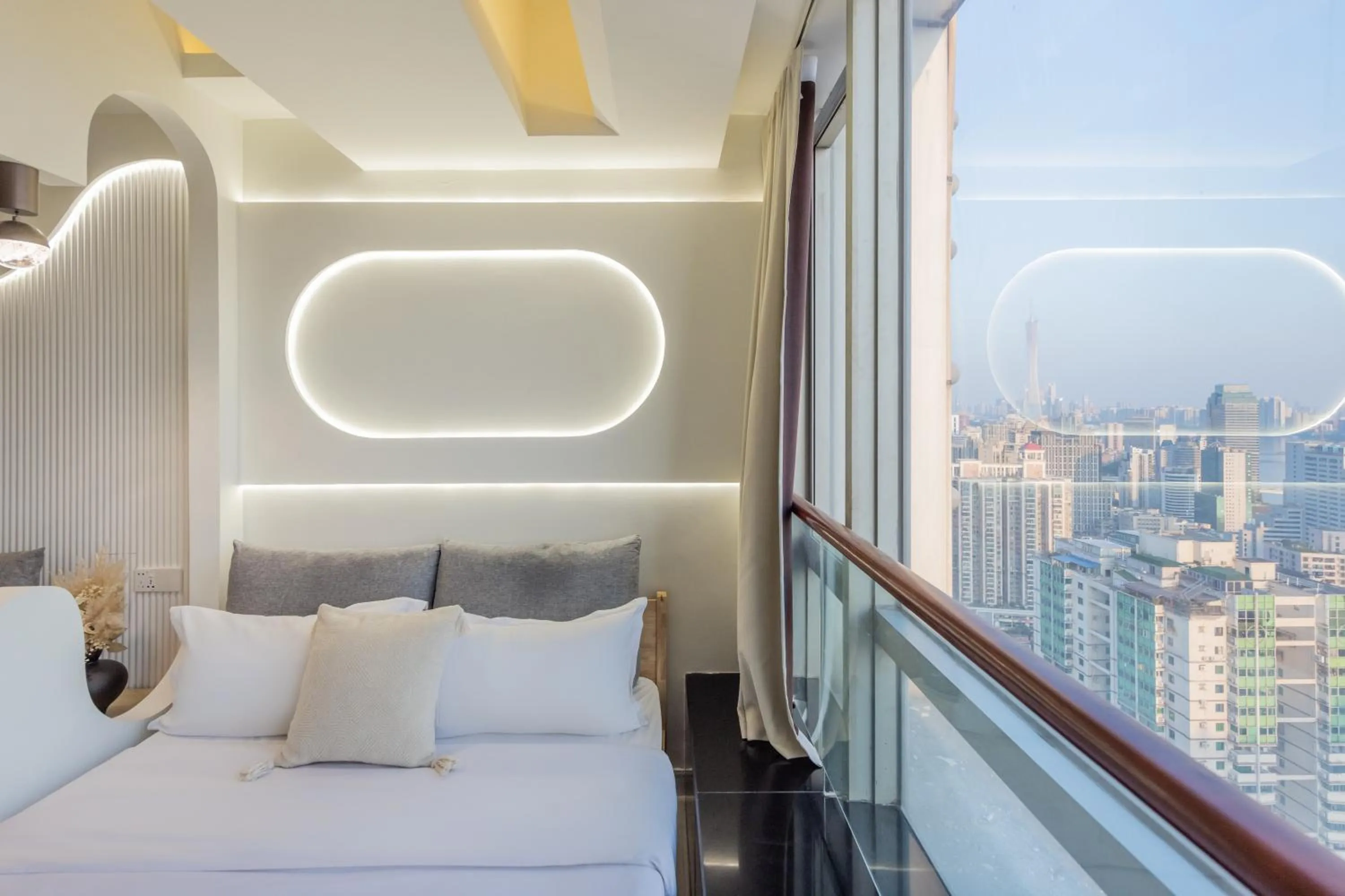 Bed in Grand Continental Apartment