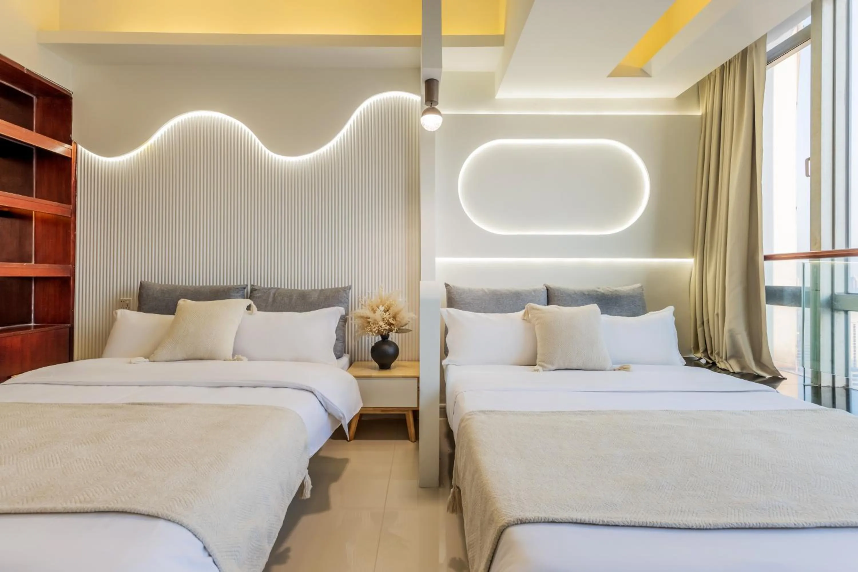 Bed in Grand Continental Apartment