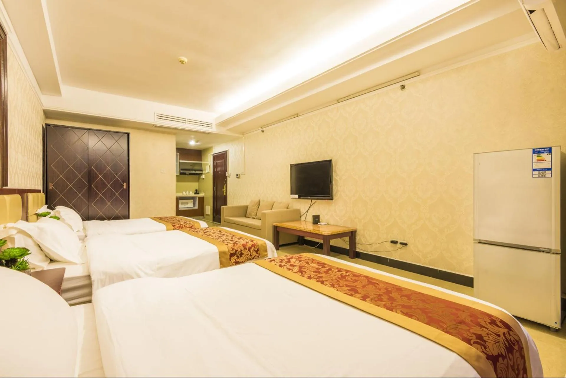 Bed in Grand Continental Apartment