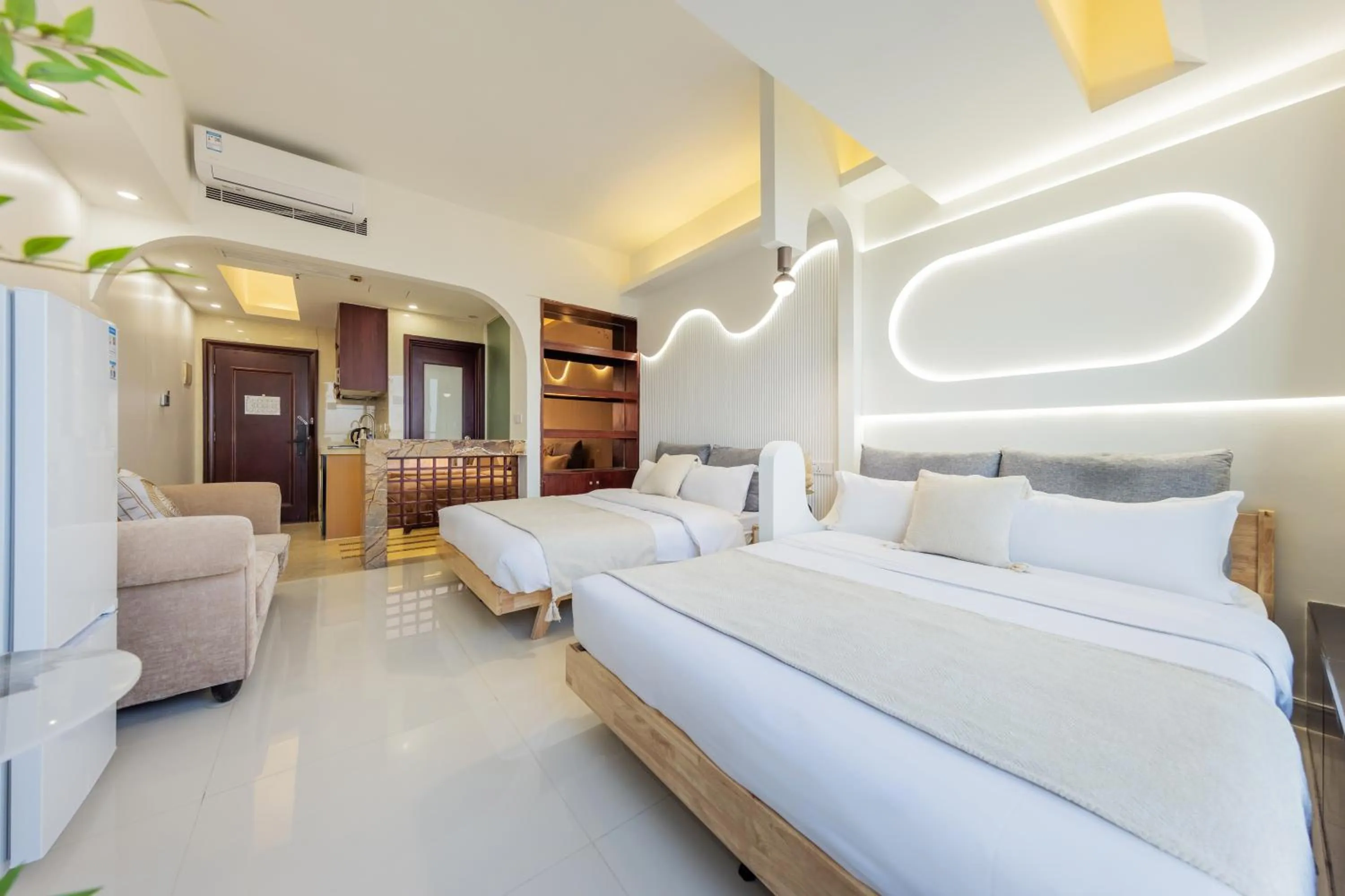 Bed in Grand Continental Apartment