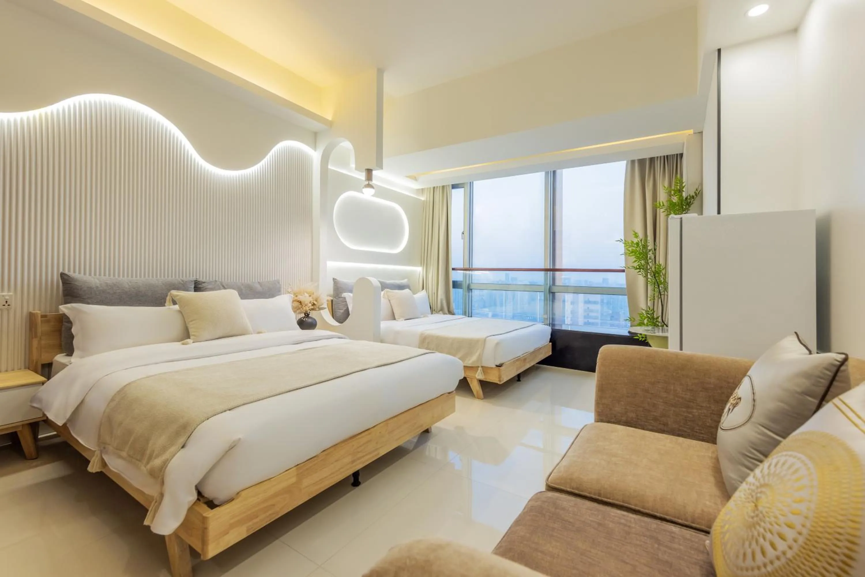 Bed in Grand Continental Apartment