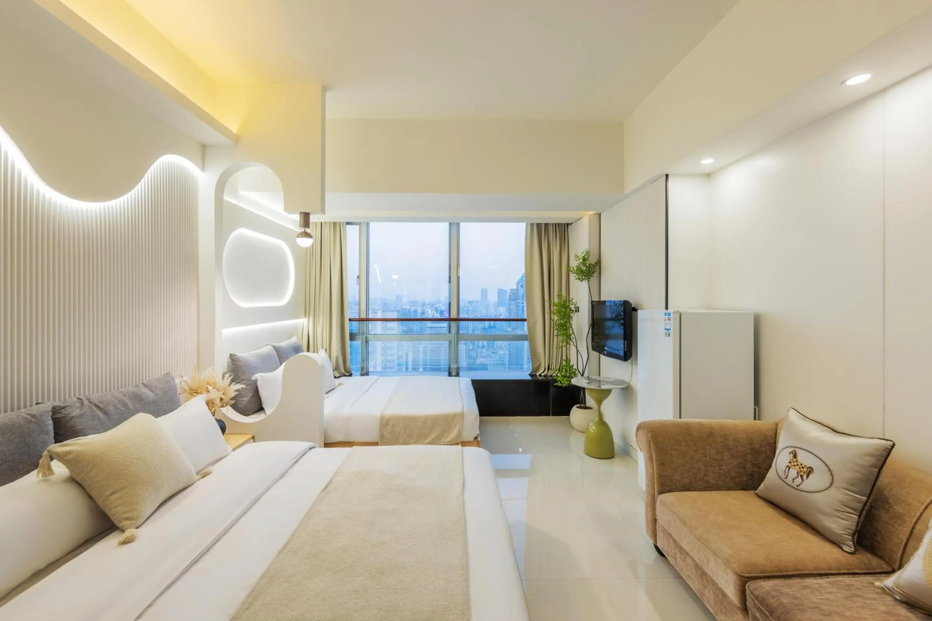 Bed in Grand Continental Apartment