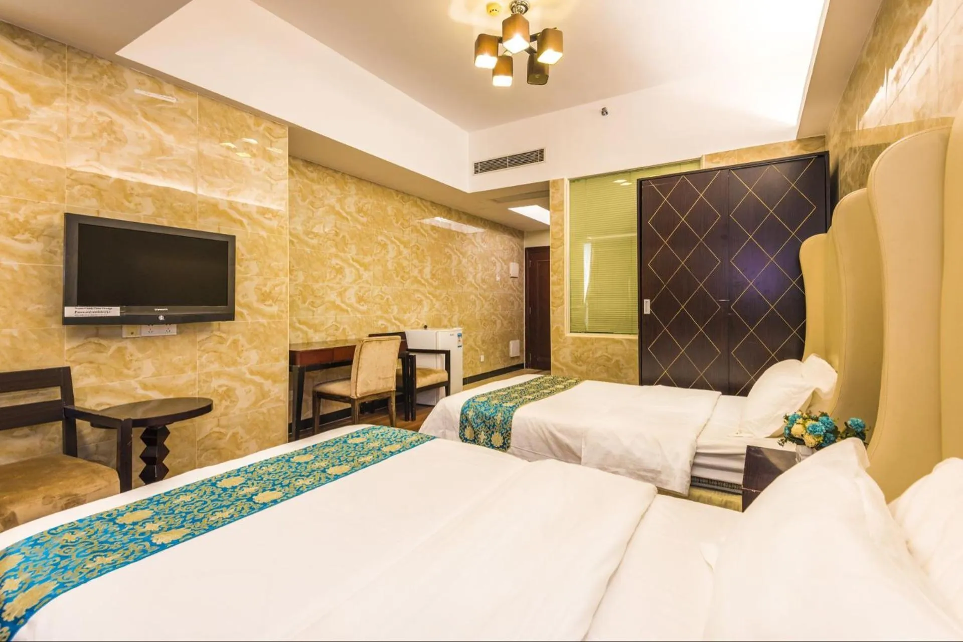 Bed in Grand Continental Apartment