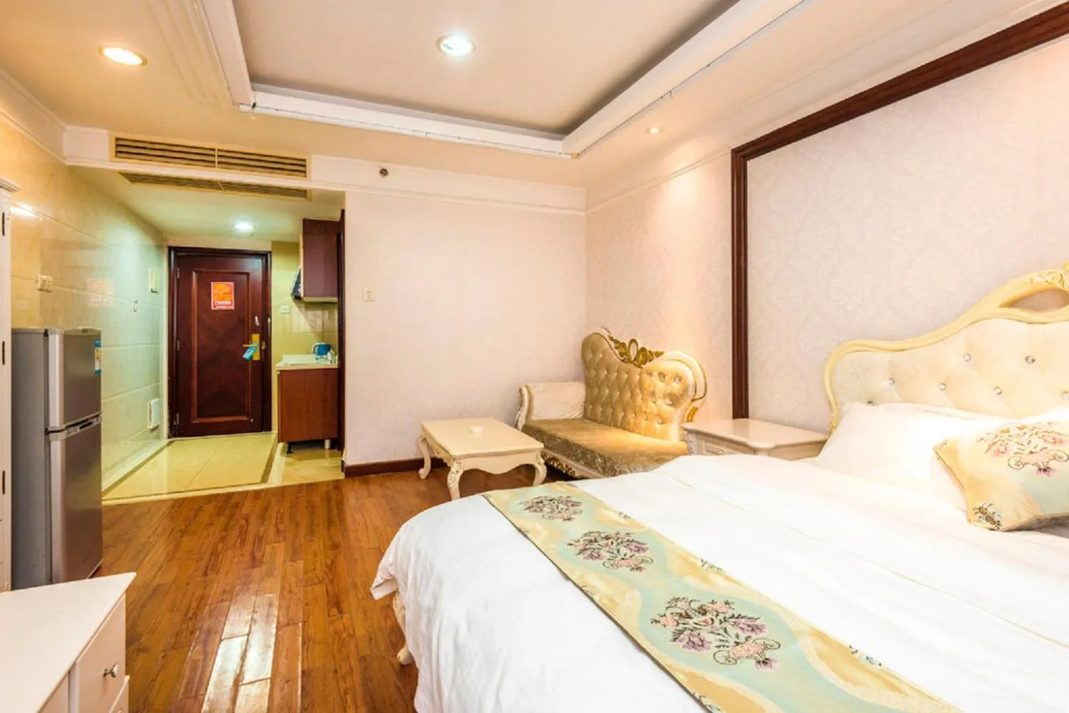 Bed in Grand Continental Apartment