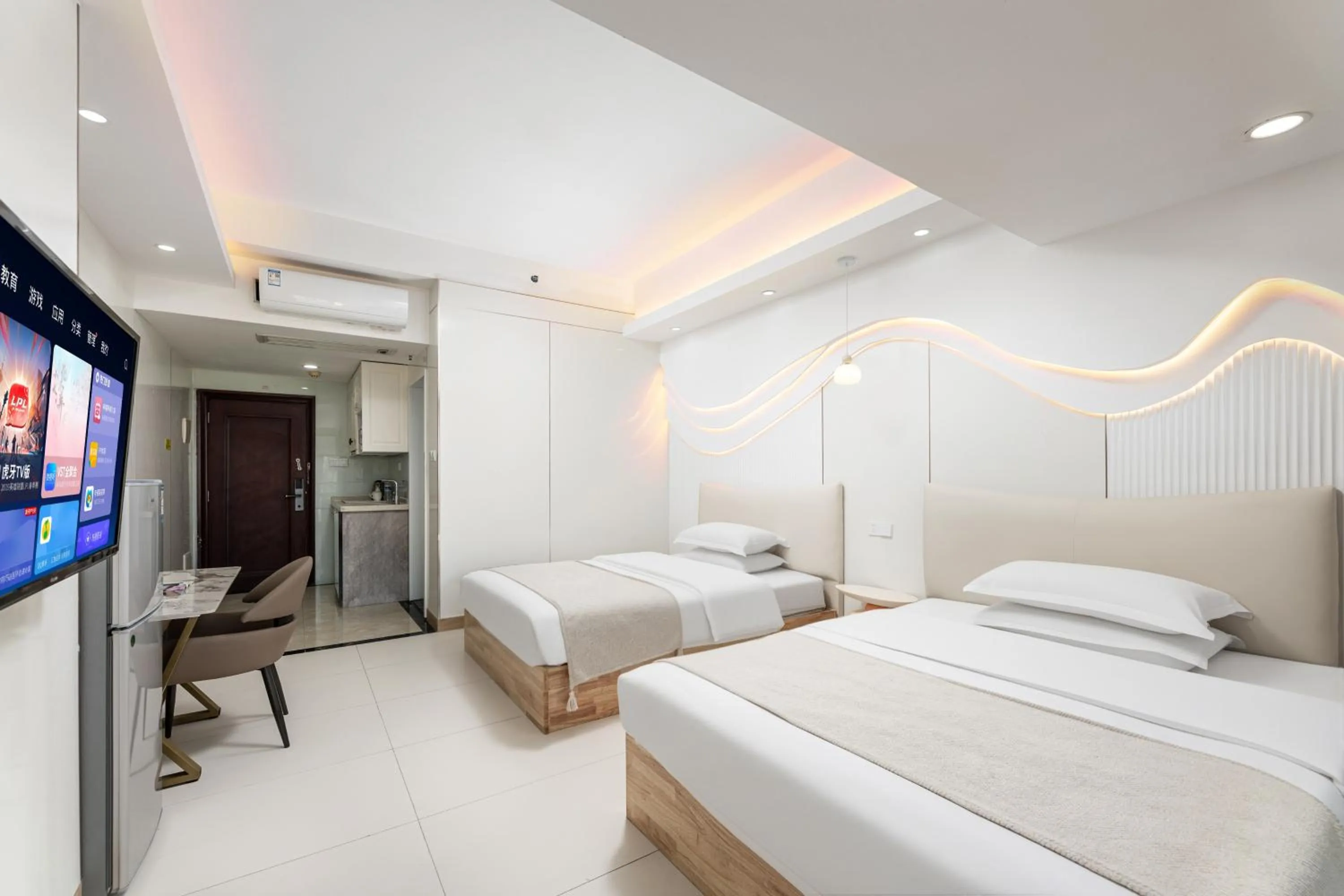 Bed in Grand Continental Apartment