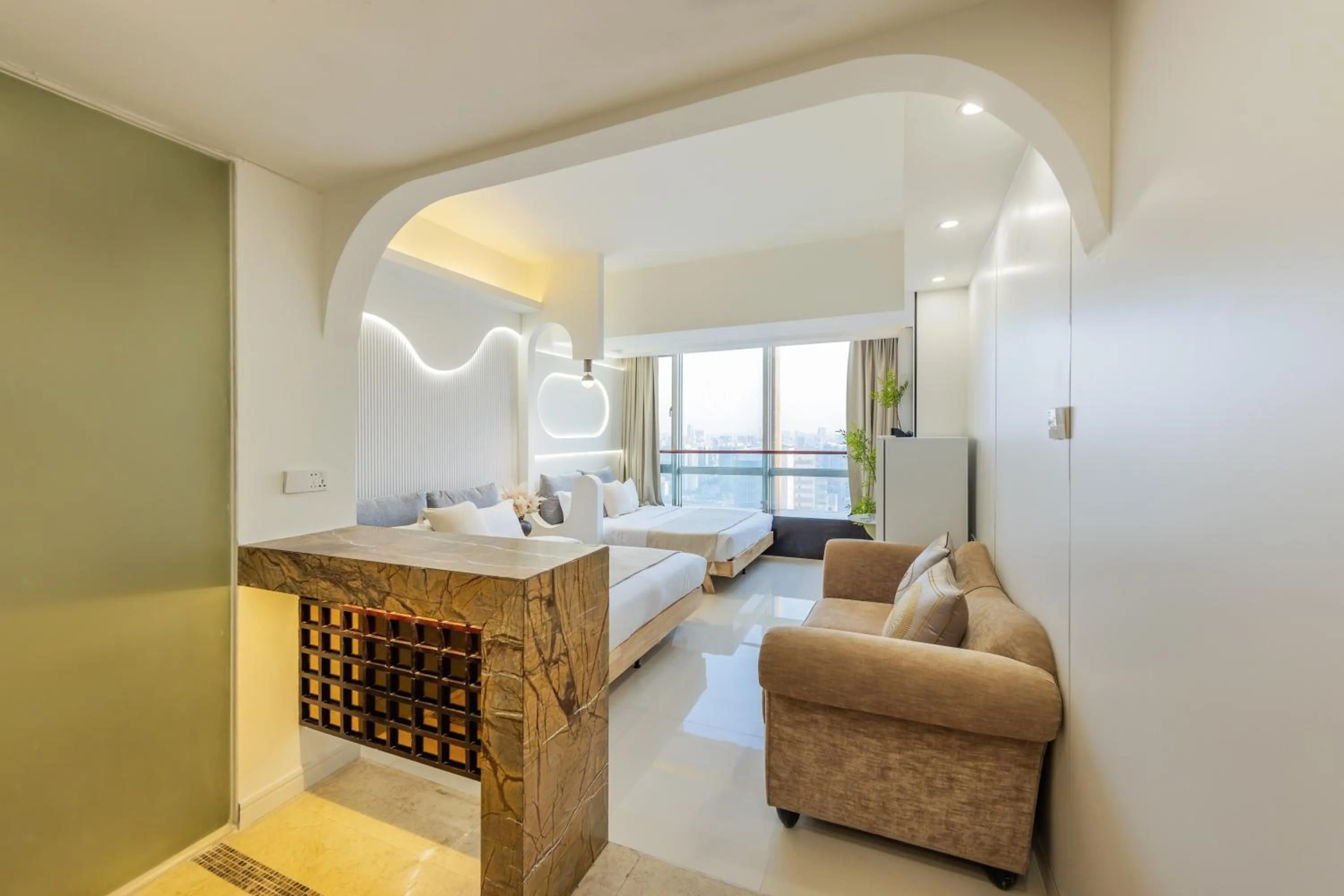 Bed in Grand Continental Apartment