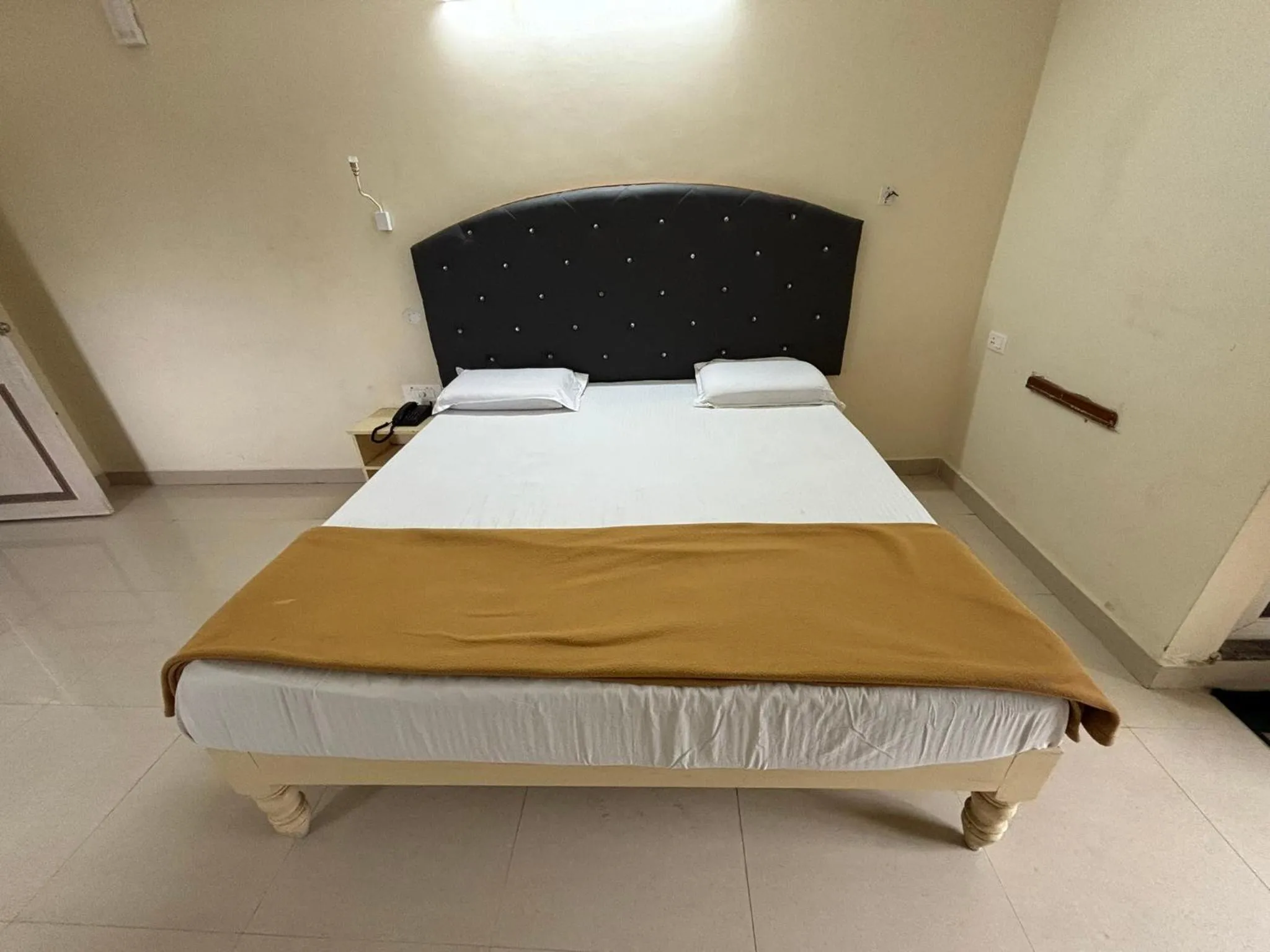 Bed in Srinivasa Hotel