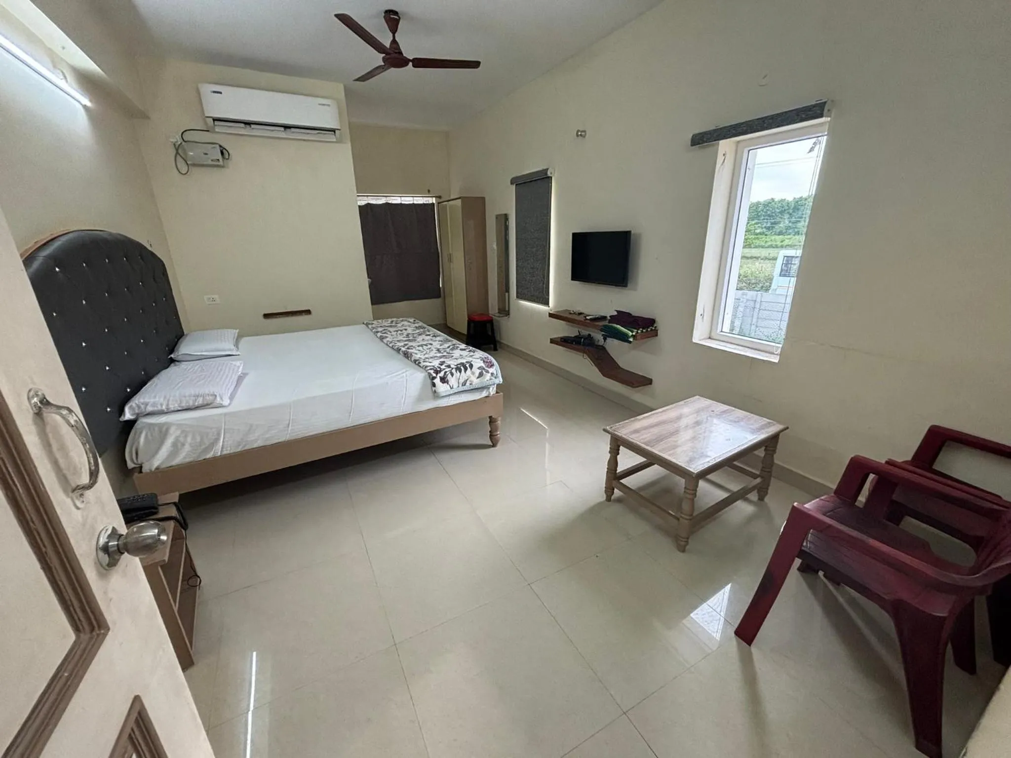 Bed in Srinivasa Hotel