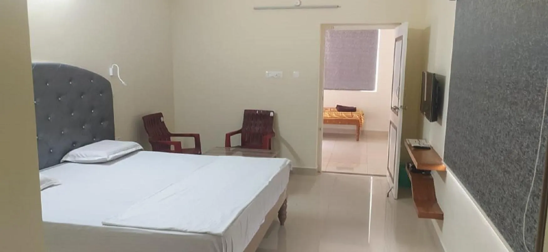 Bed in Srinivasa Hotel