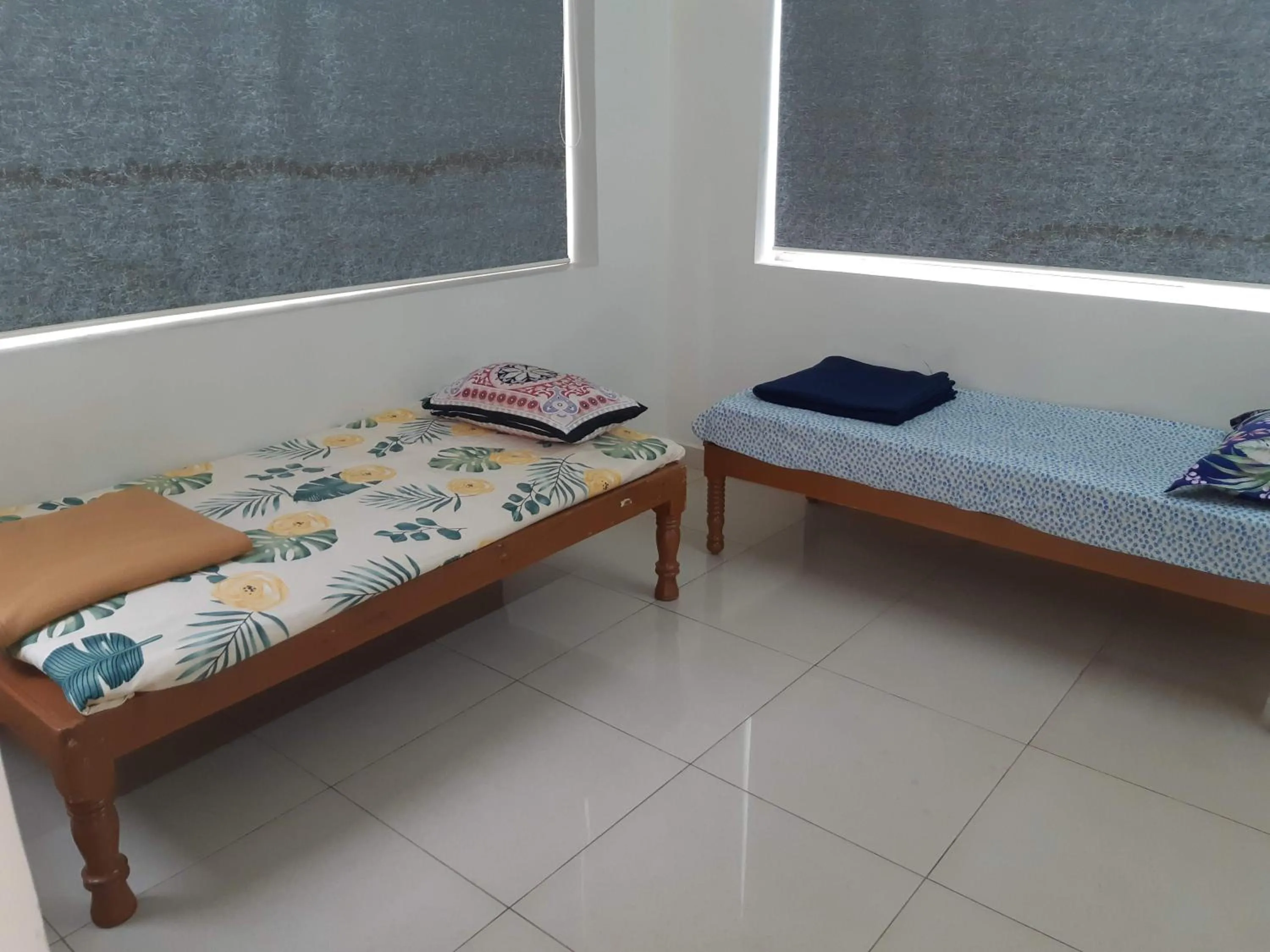 Bed in Srinivasa Hotel