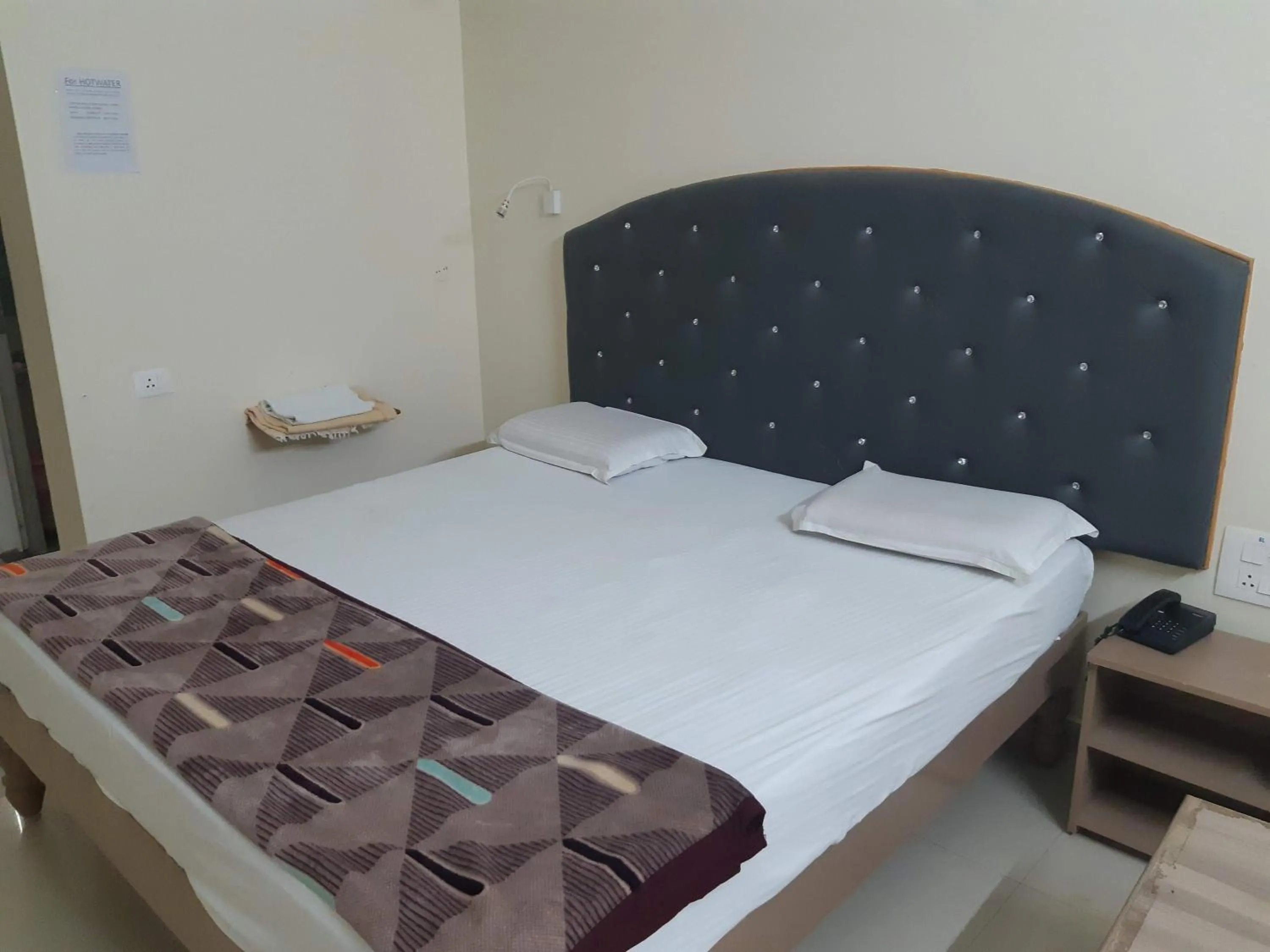 Bed in Srinivasa Hotel