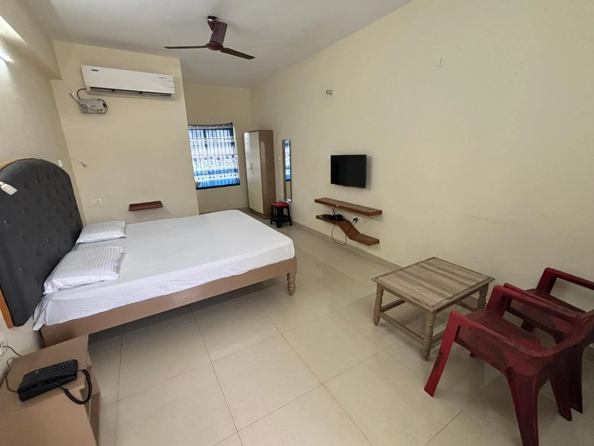 Bed in Srinivasa Hotel