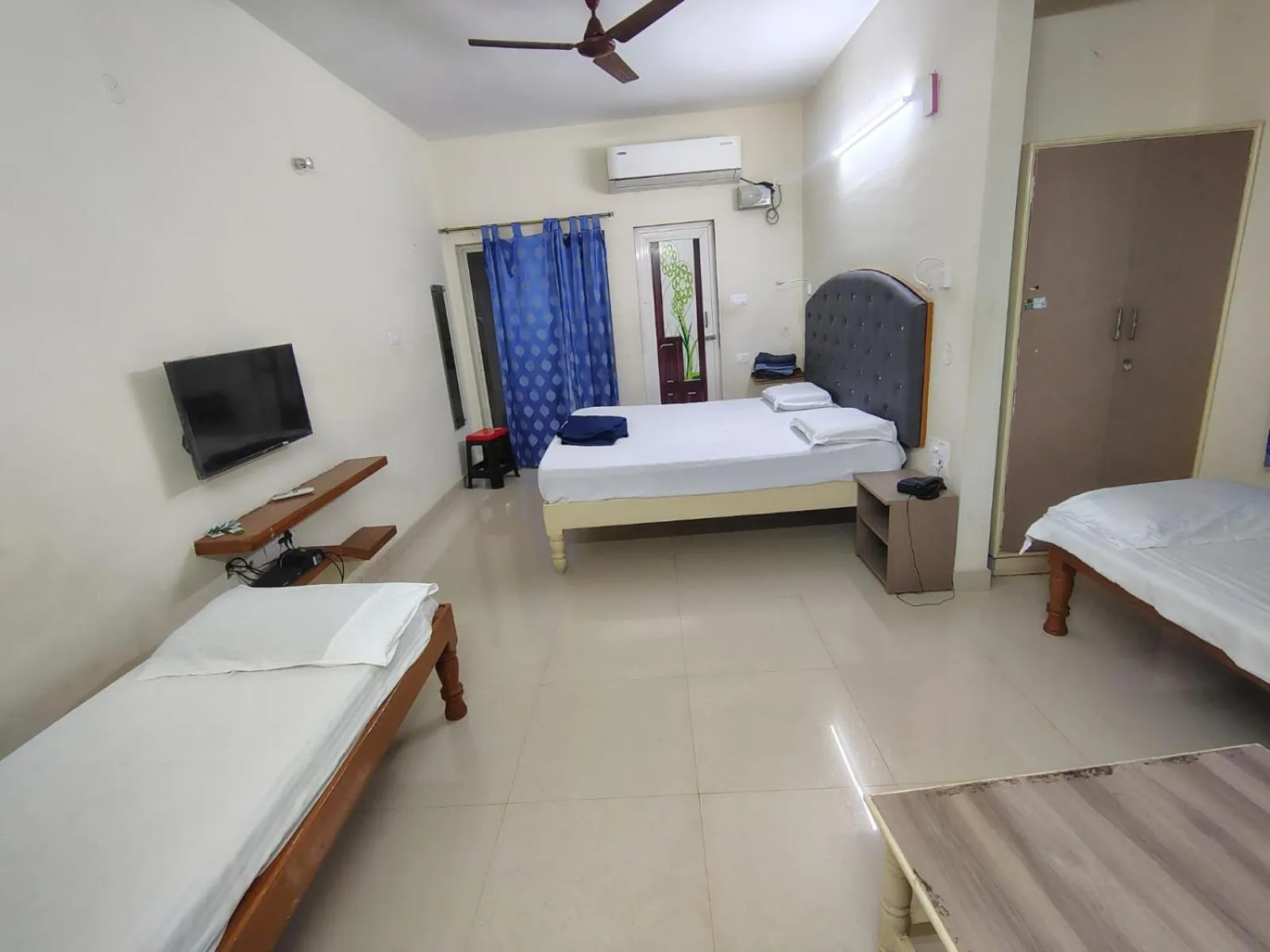 Bed in Srinivasa Hotel