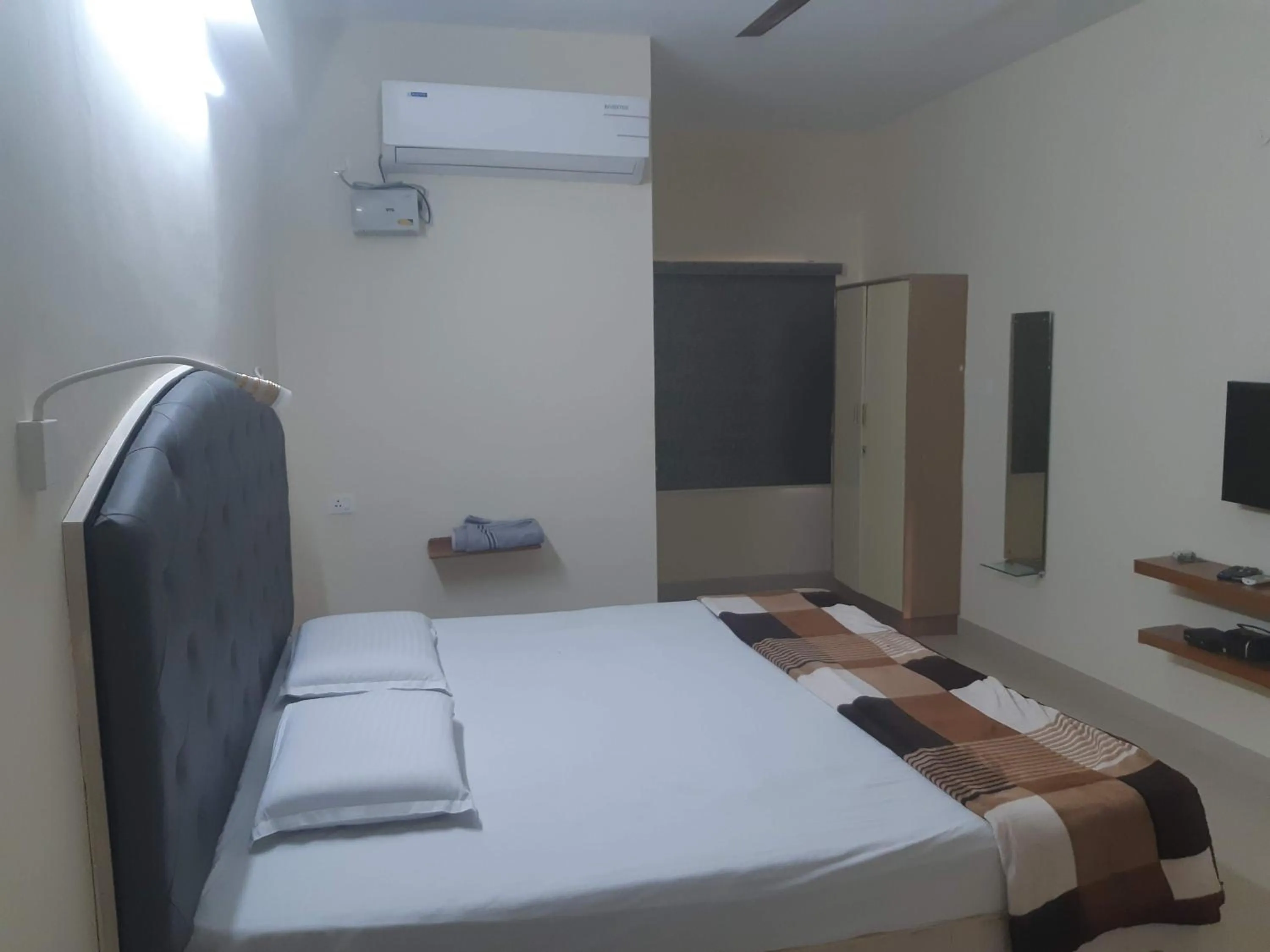 Bed in Srinivasa Hotel