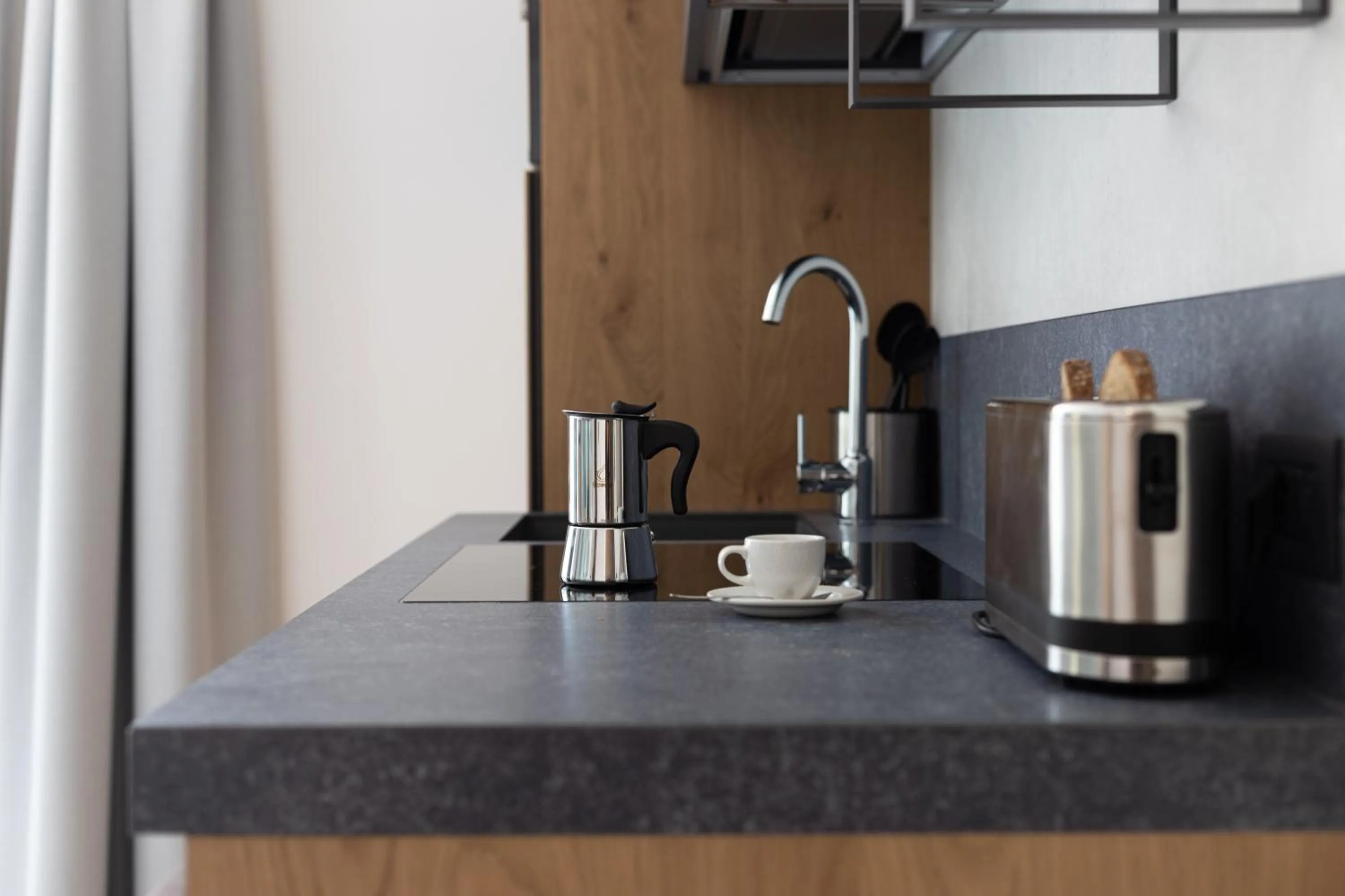 Kitchen or kitchenette in Aris Apartments & Sky Pool - Tonelli Hotels - Adult Friendly