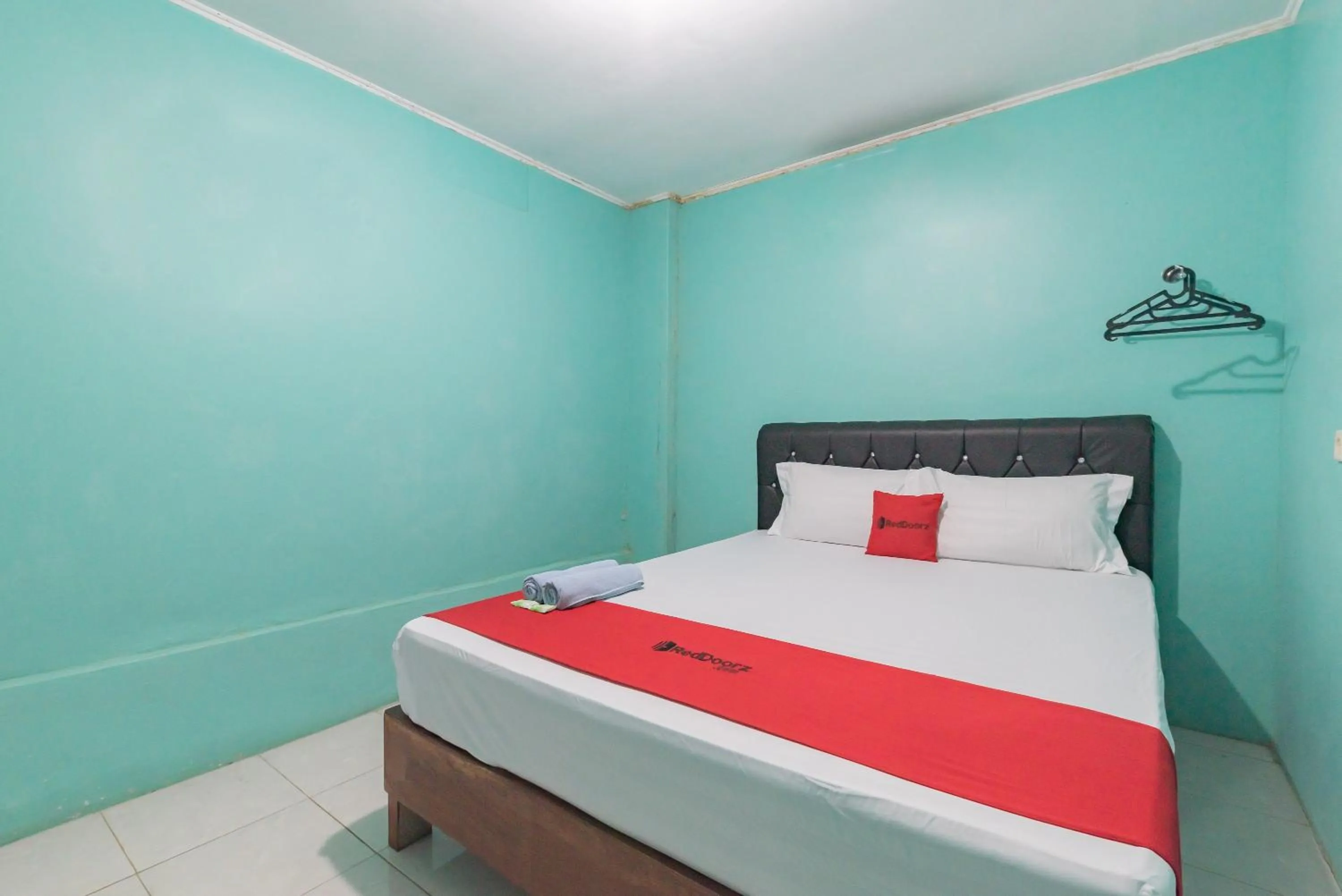 Bed in RedDoorz near Pantai Ujung Genteng