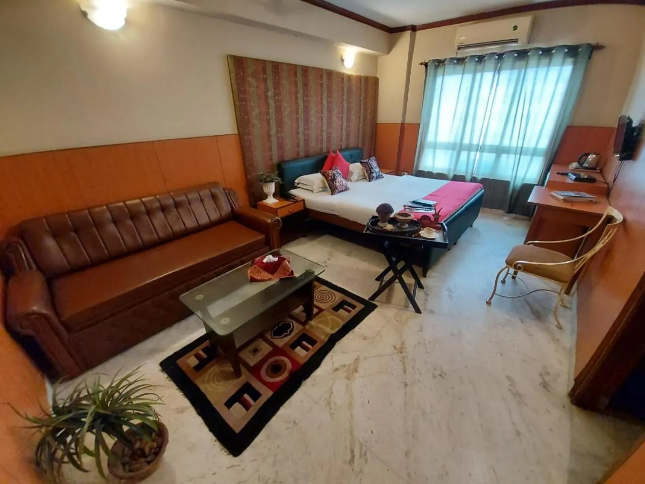 Seating area, Bed in Malik Guest House