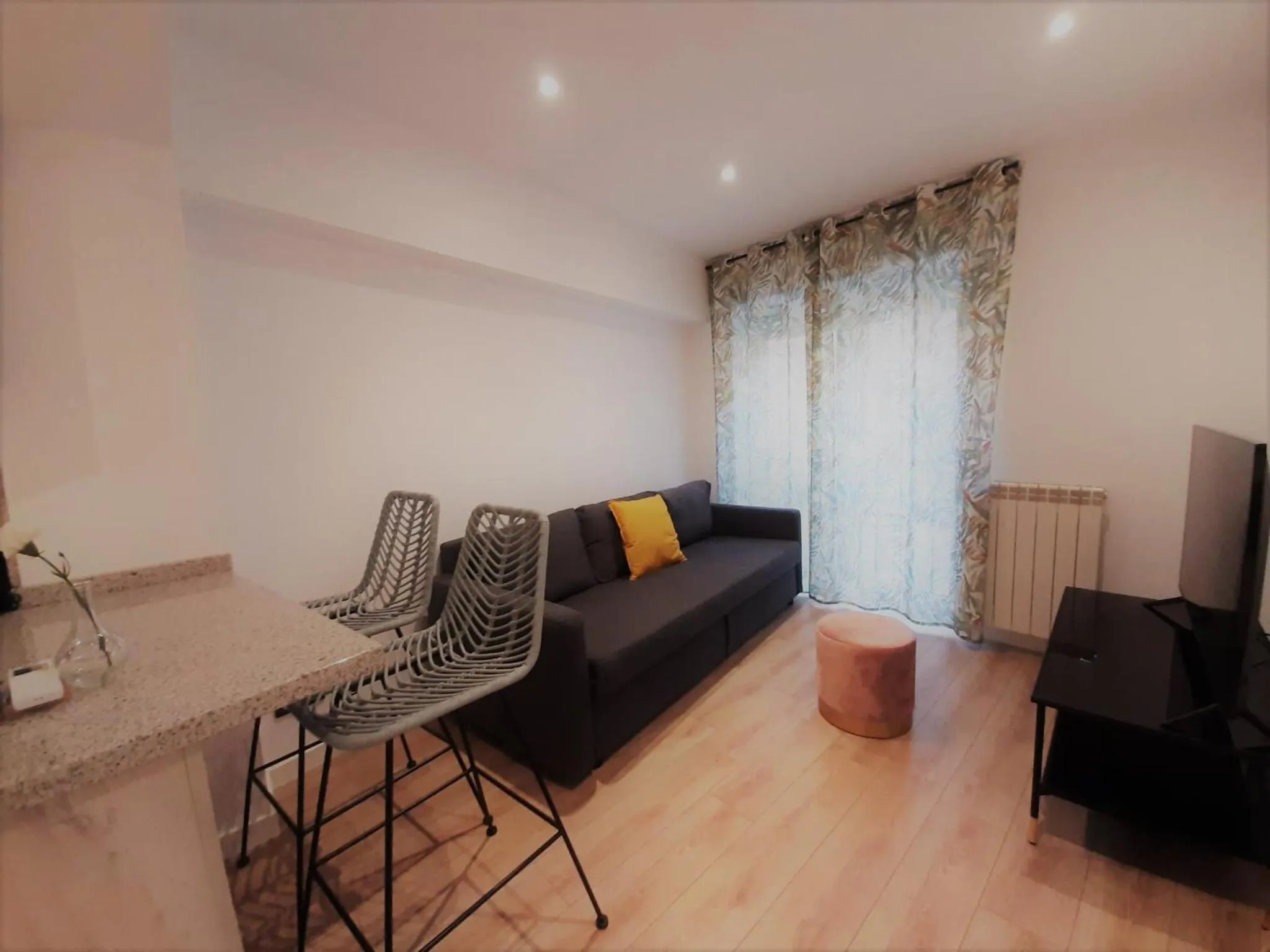 Living room in Apartamentos Celestina by gaiarooms