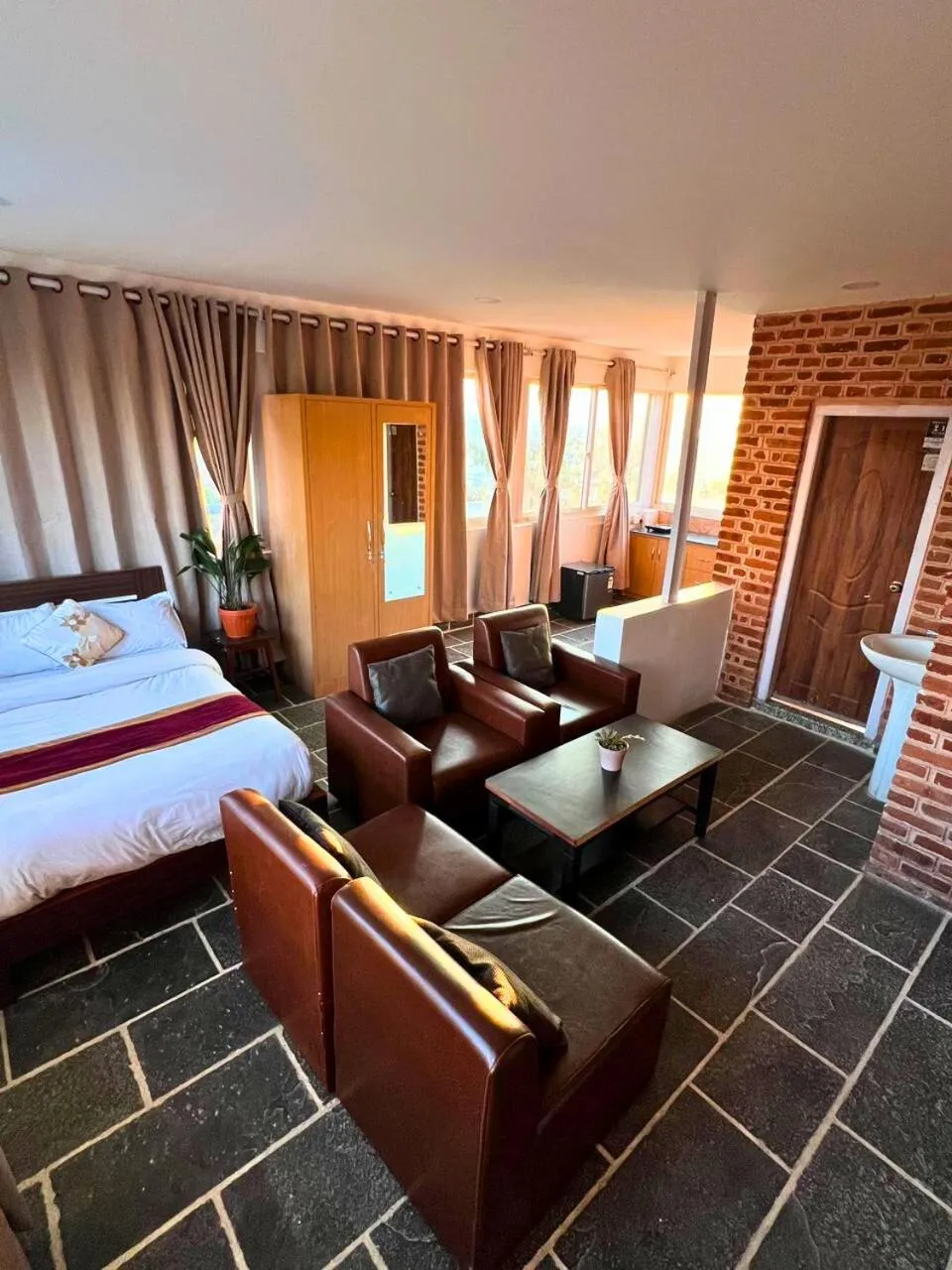 Seating area, Bed in Deepjyoti Inn