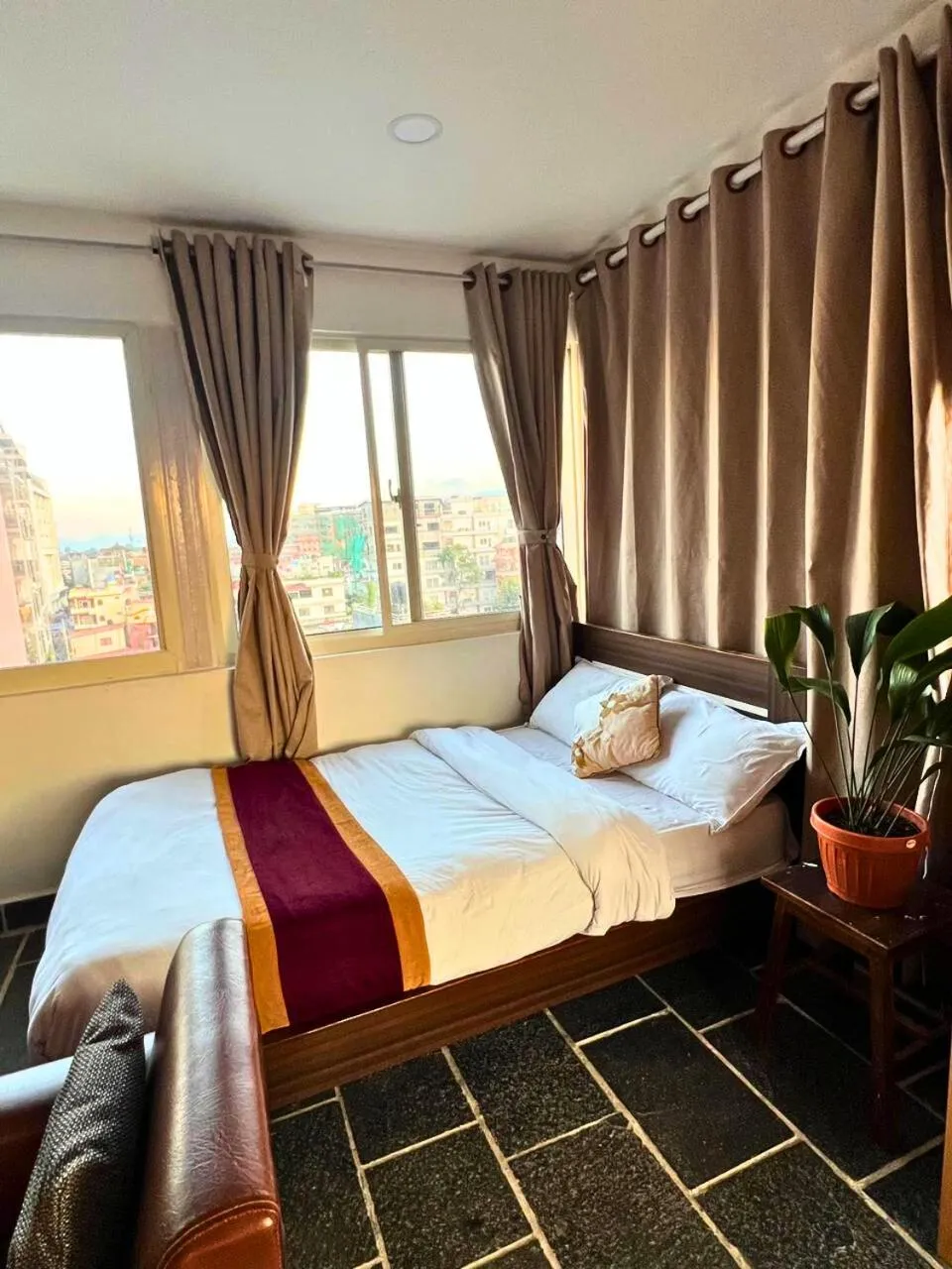 Bed in Deepjyoti Inn