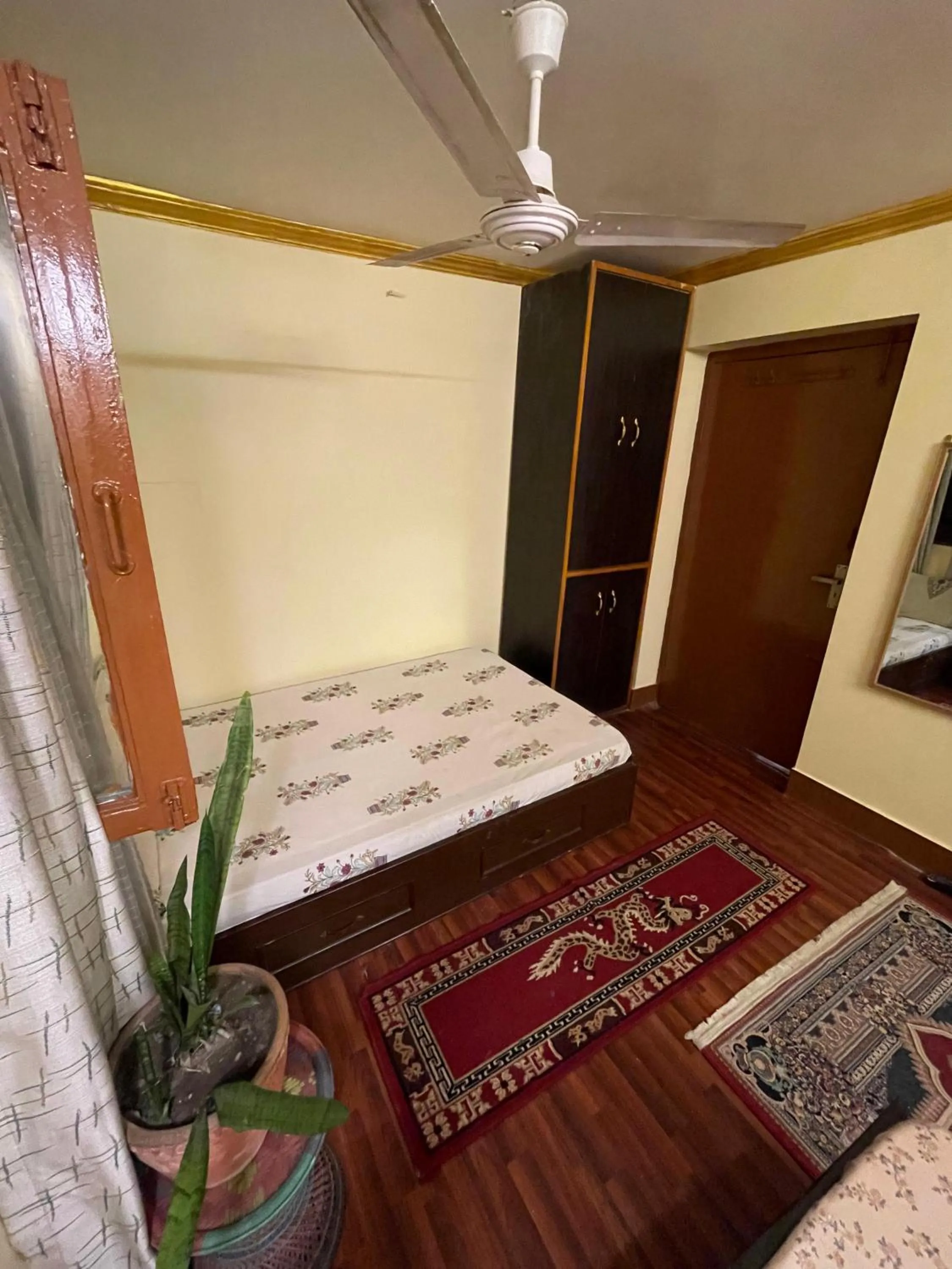 Bed in Deepjyoti Inn