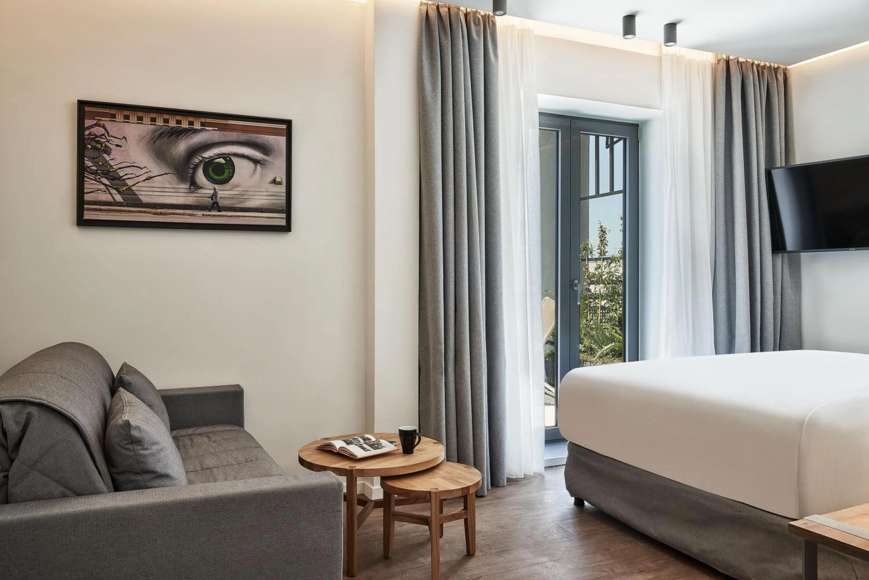 Seating area, Bed in NLH KERAMEIKOS - Neighborhood Lifestyle Hotels