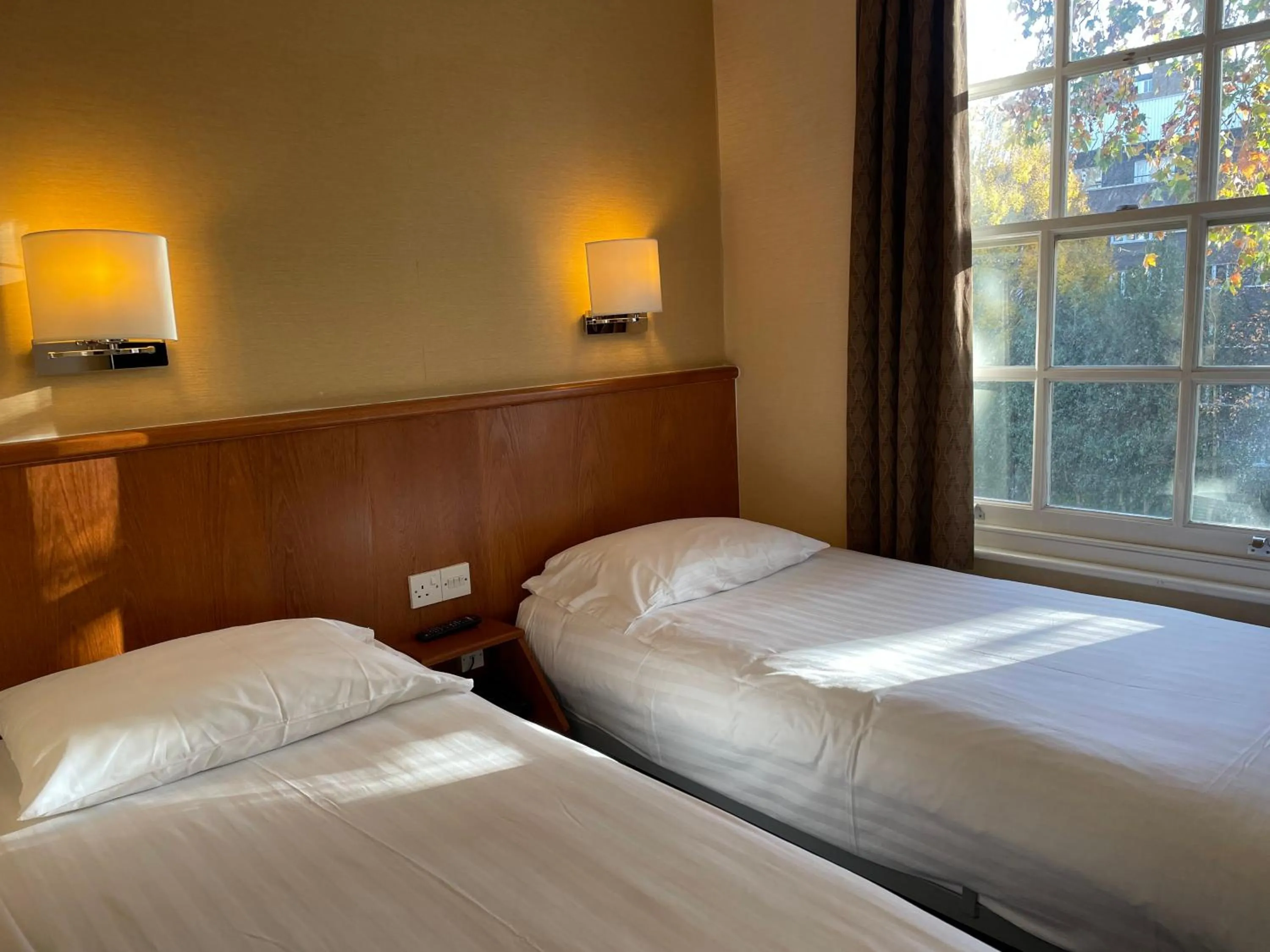 Bed in Orchard Hotel