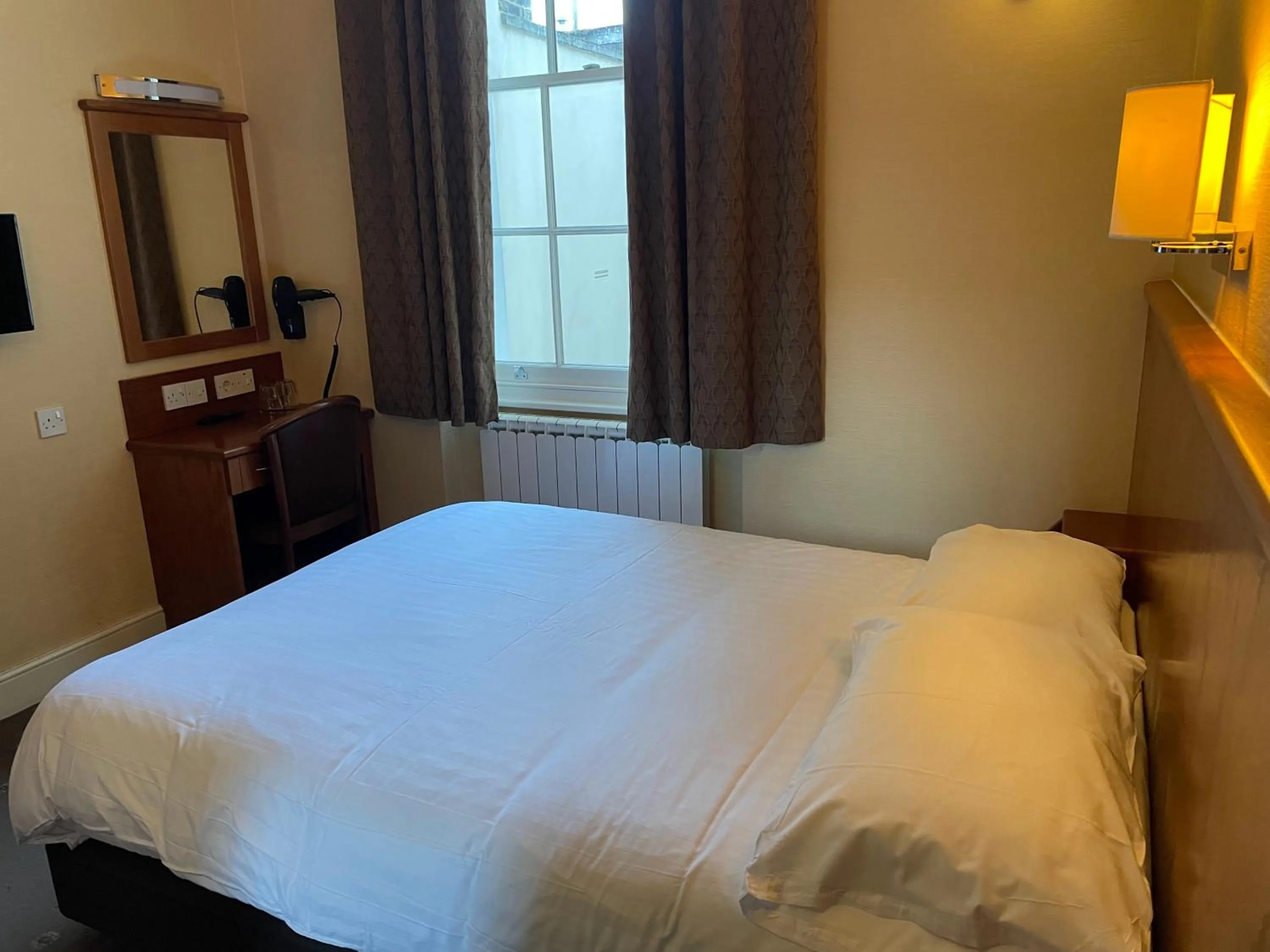 Bed in Orchard Hotel