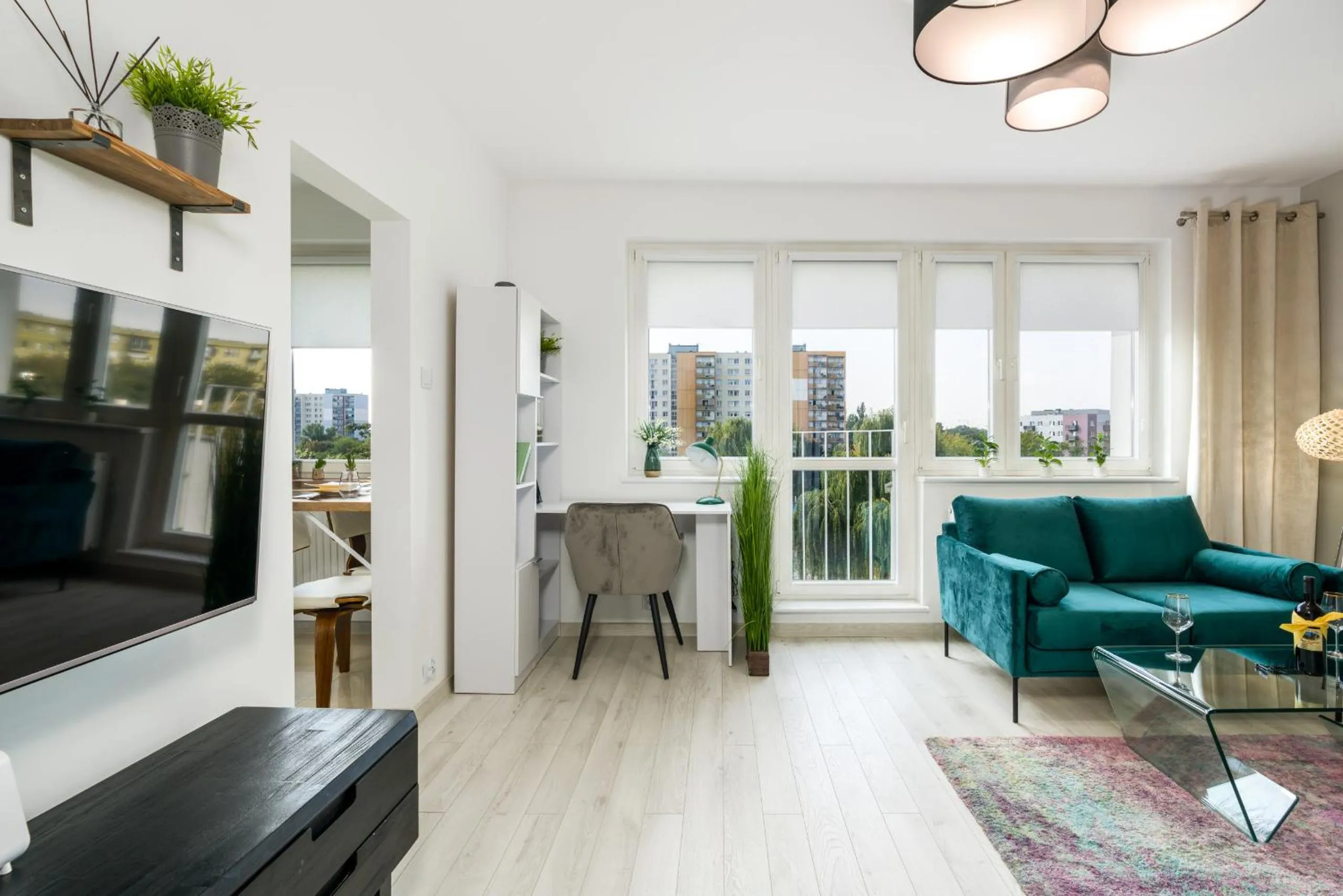 Communal lounge/ TV room in Apartments Poznań Keplera by Noclegi Renters