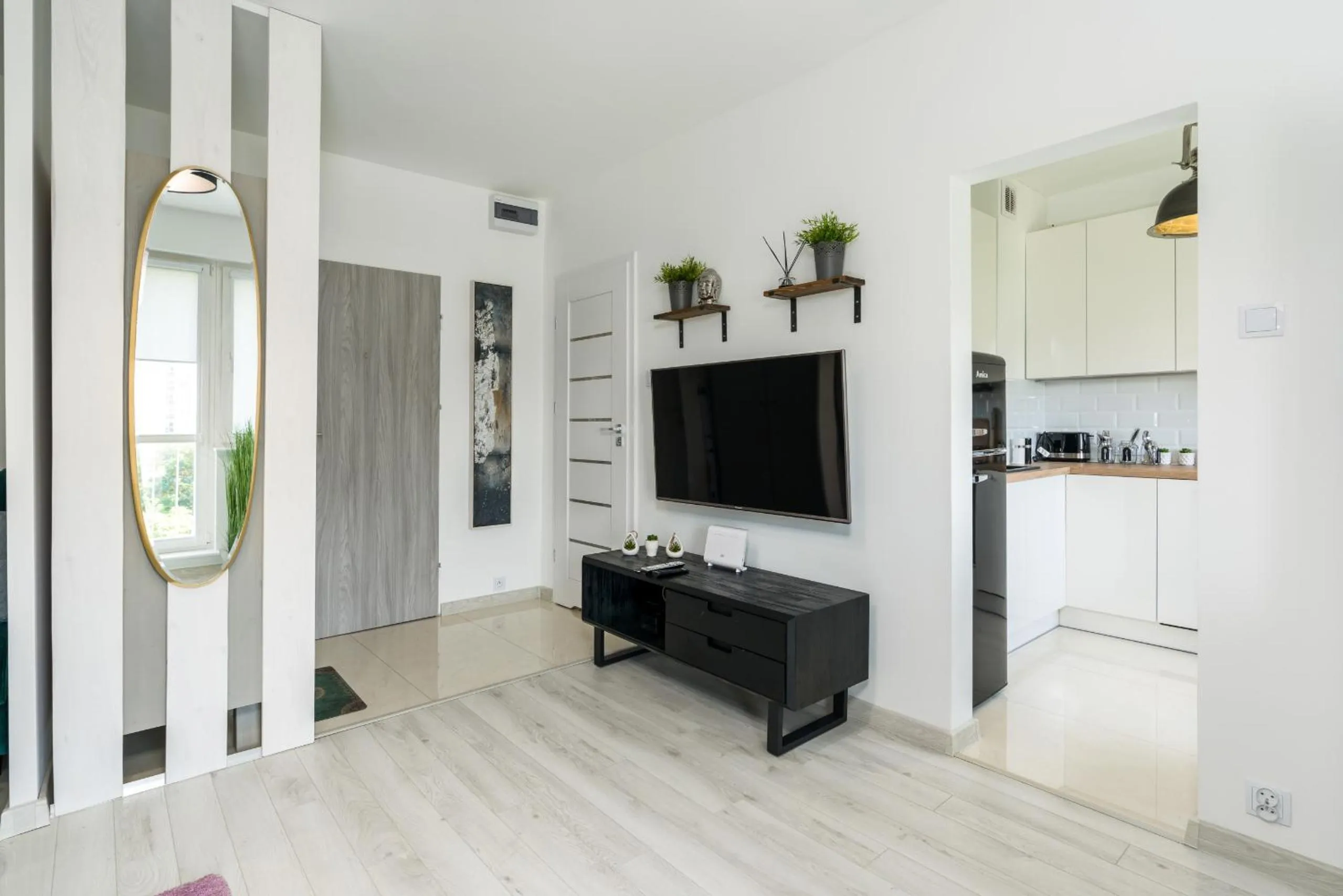 Communal lounge/ TV room in Apartments Poznań Keplera by Noclegi Renters