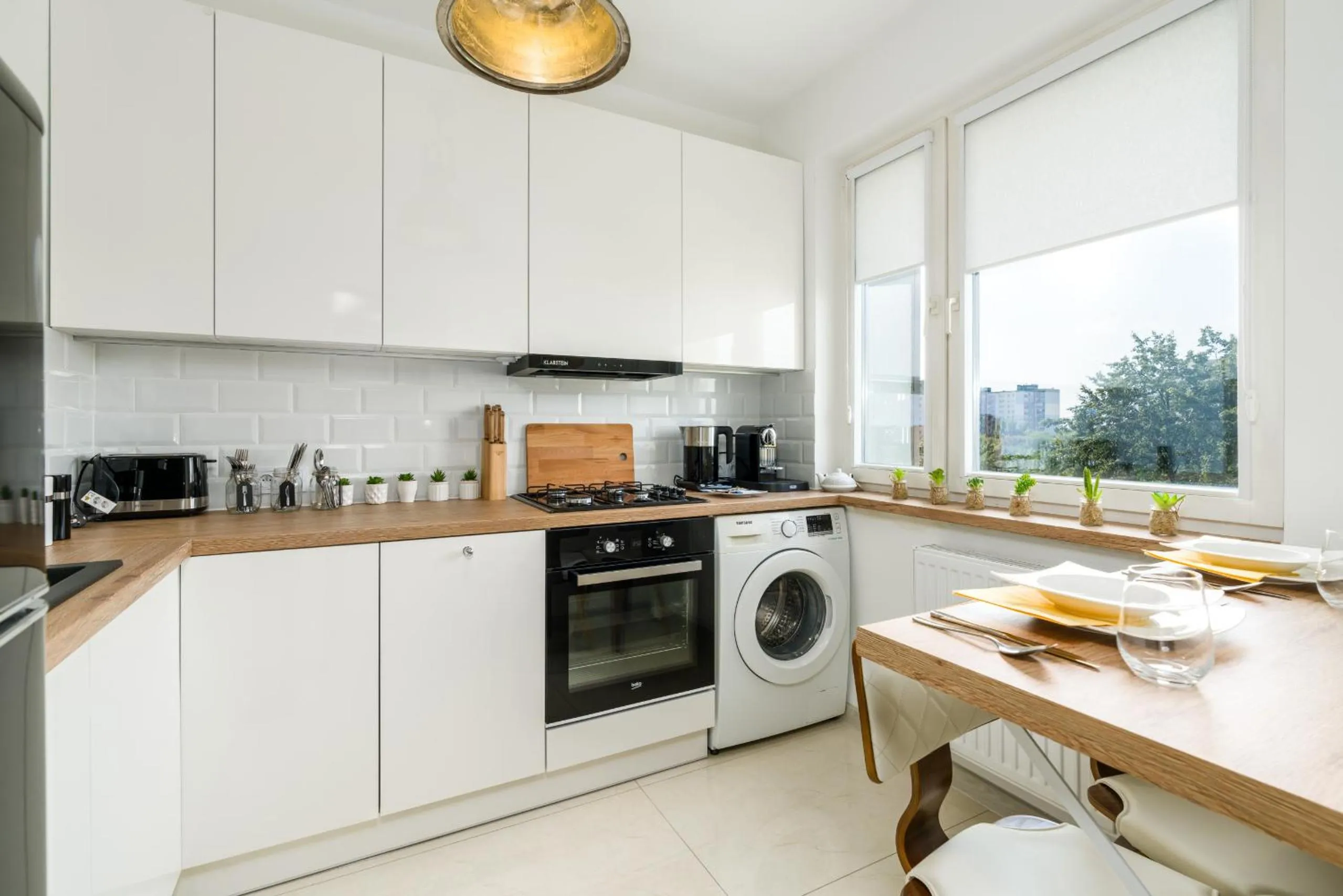 Kitchen or kitchenette in Apartments Poznań Keplera by Noclegi Renters