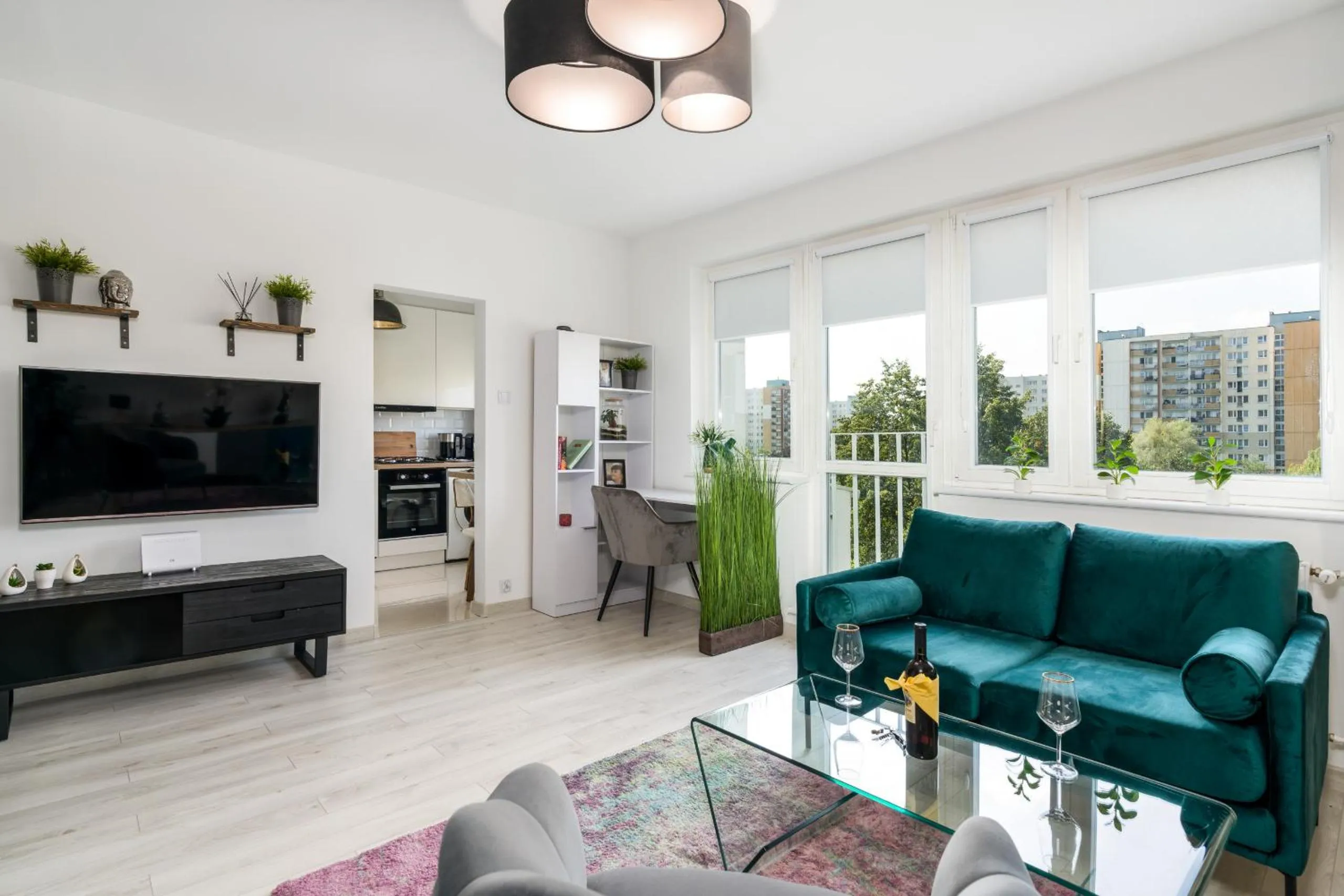 Communal lounge/ TV room in Apartments Poznań Keplera by Noclegi Renters