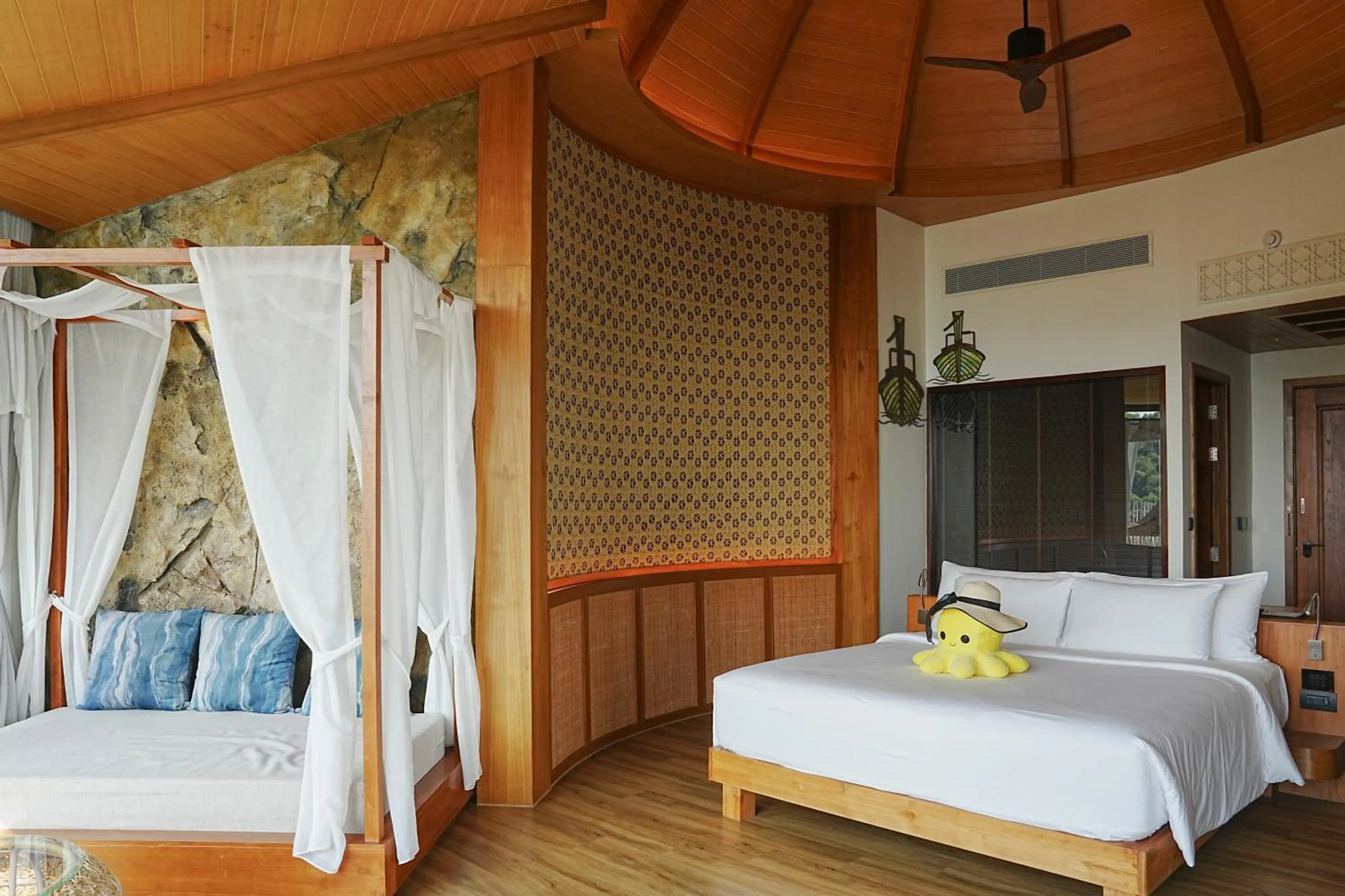 Bed in SINAE Phuket Luxury Hotel