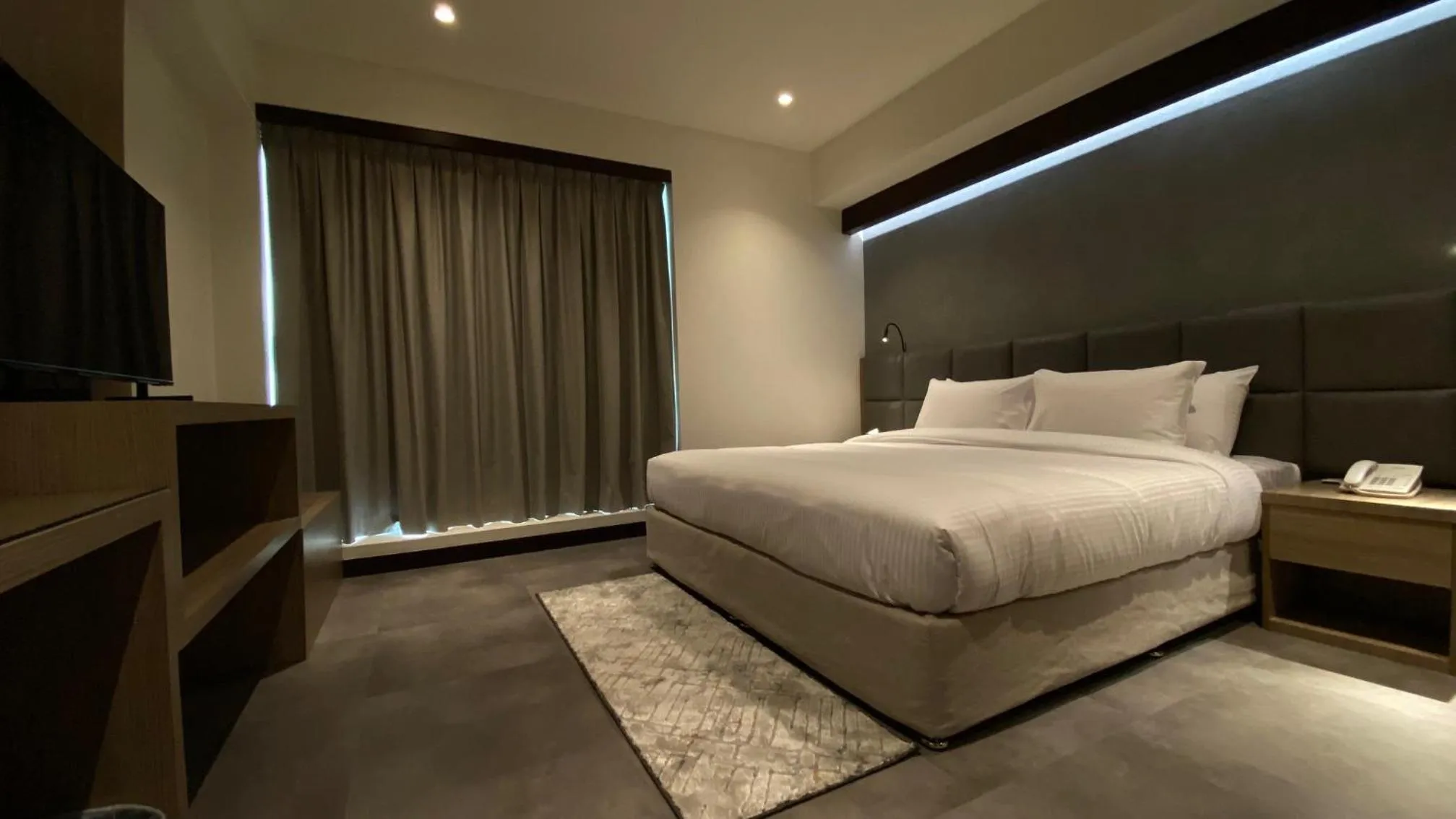 Bed in SITARA HOTEL APARTMENT