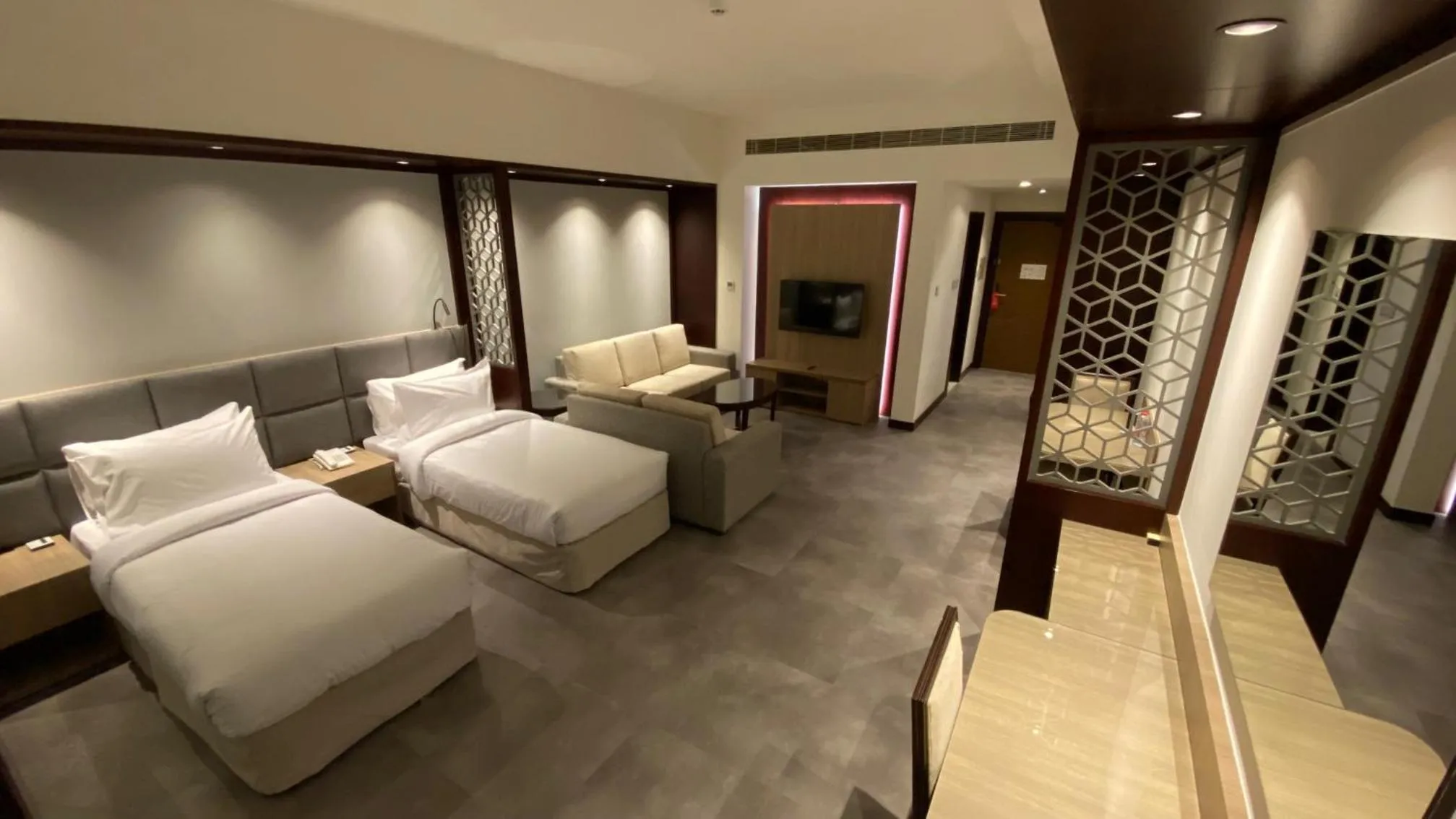 Living room, Bed in SITARA HOTEL APARTMENT